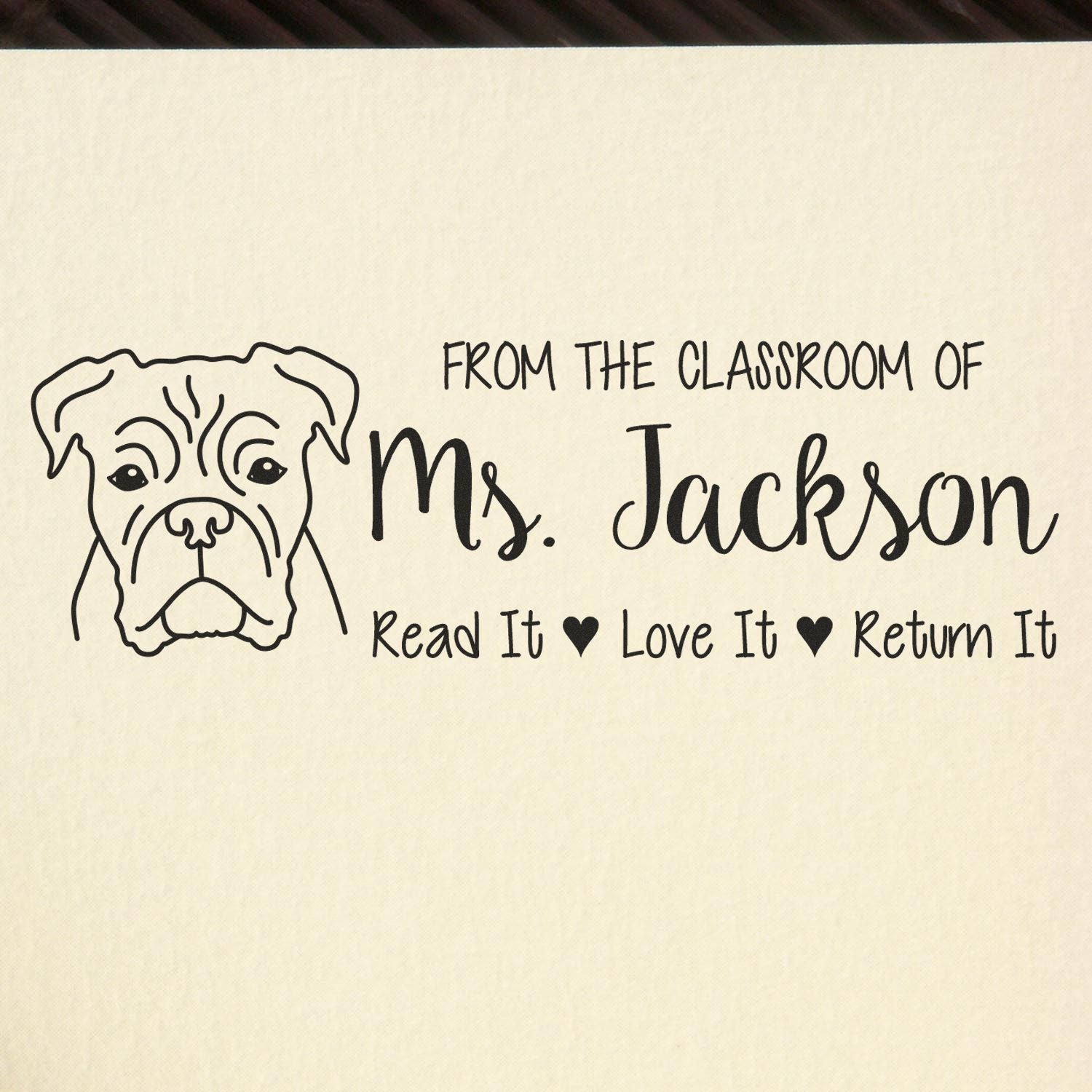Custom teacher rubber stamp with bulldog design: From the classroom of Ms. Jackson, Read It Love It Return It.