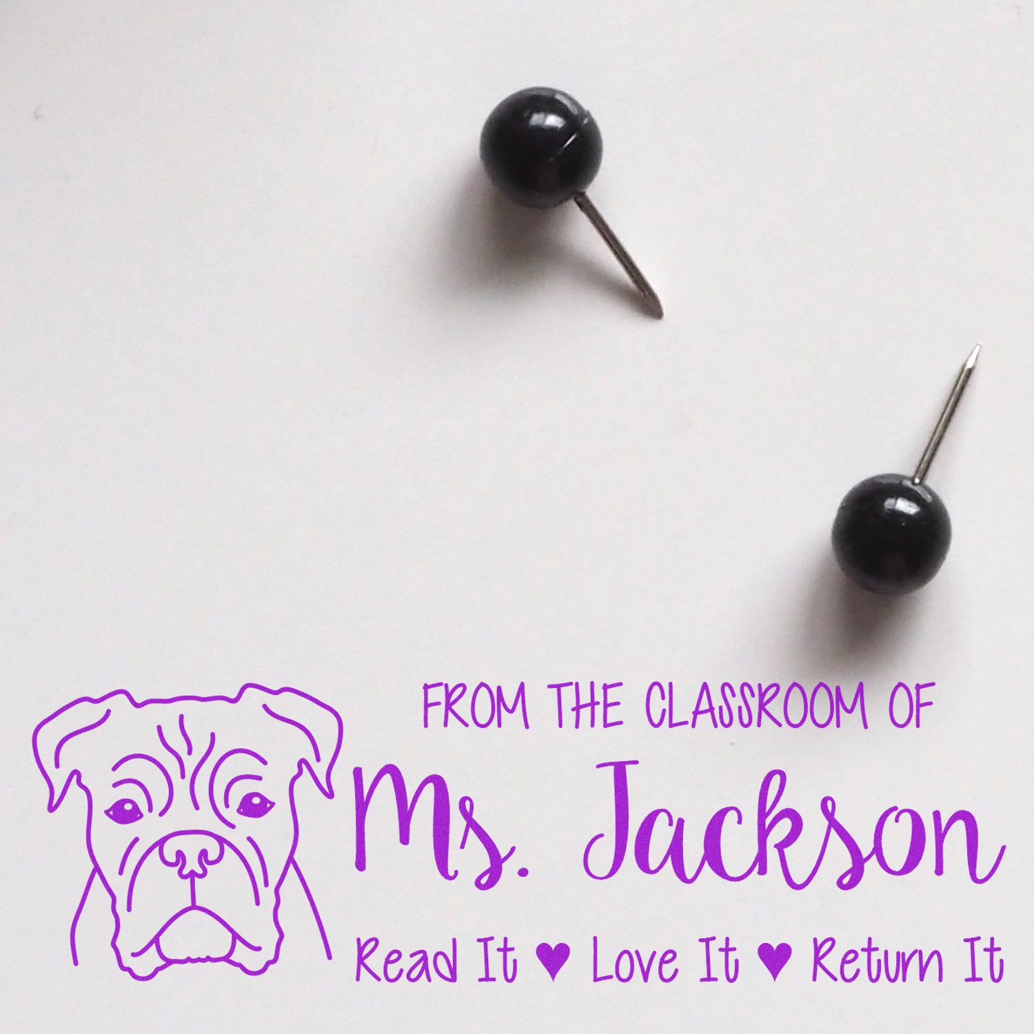 Personalized teacher rubber stamp for classroom books, featuring Ms. Jackson, dog design, and Read It Love It Return It text.