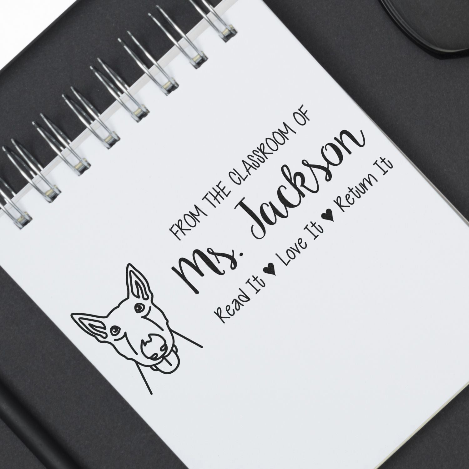 Personalized teacher rubber stamp impression for classroom books: From the Classroom of Mrs. Jackson with return message.