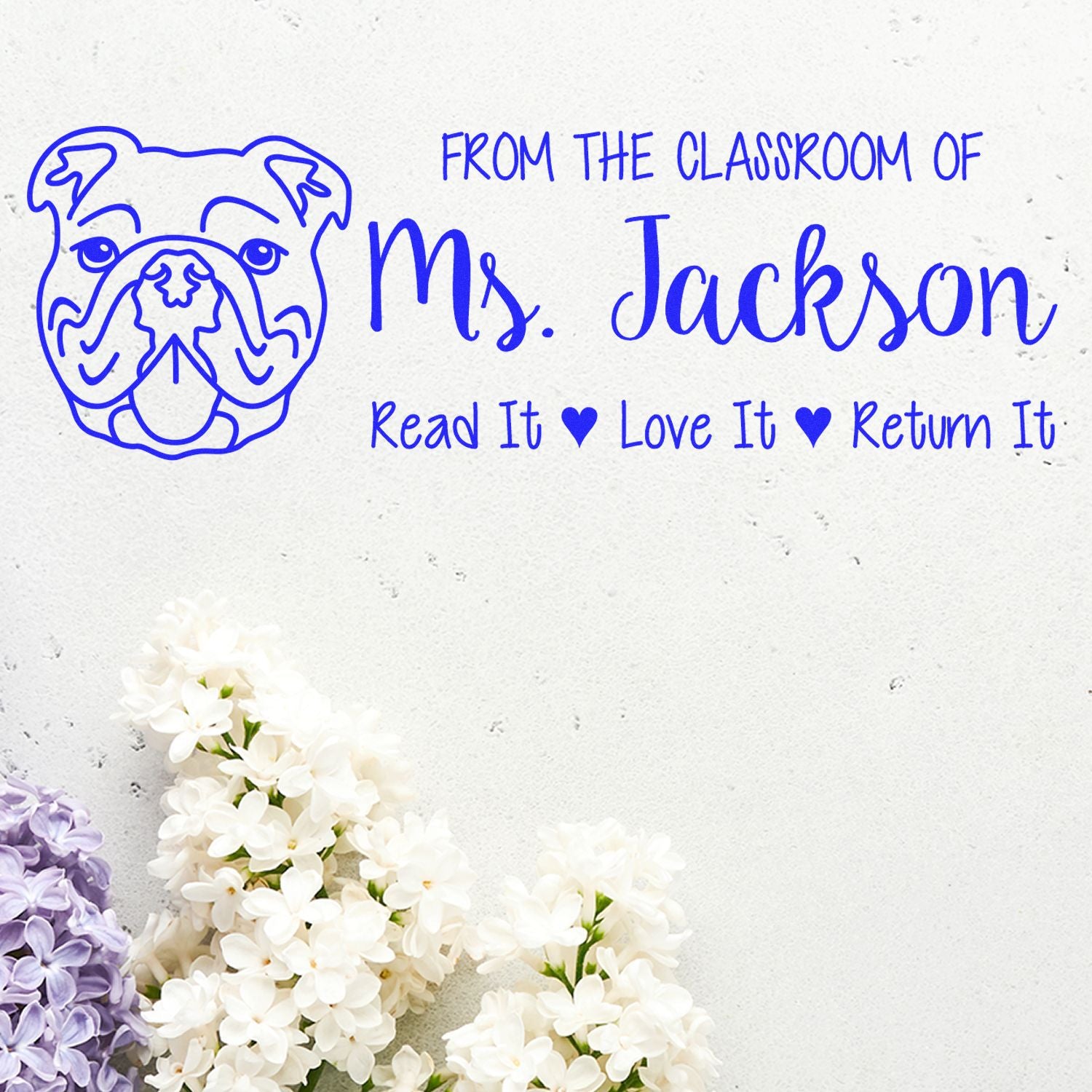 Custom teacher rubber stamp with bulldog mascot and classroom message: From the Classroom of Ms. Jackson, Read It, Love It, Return It.