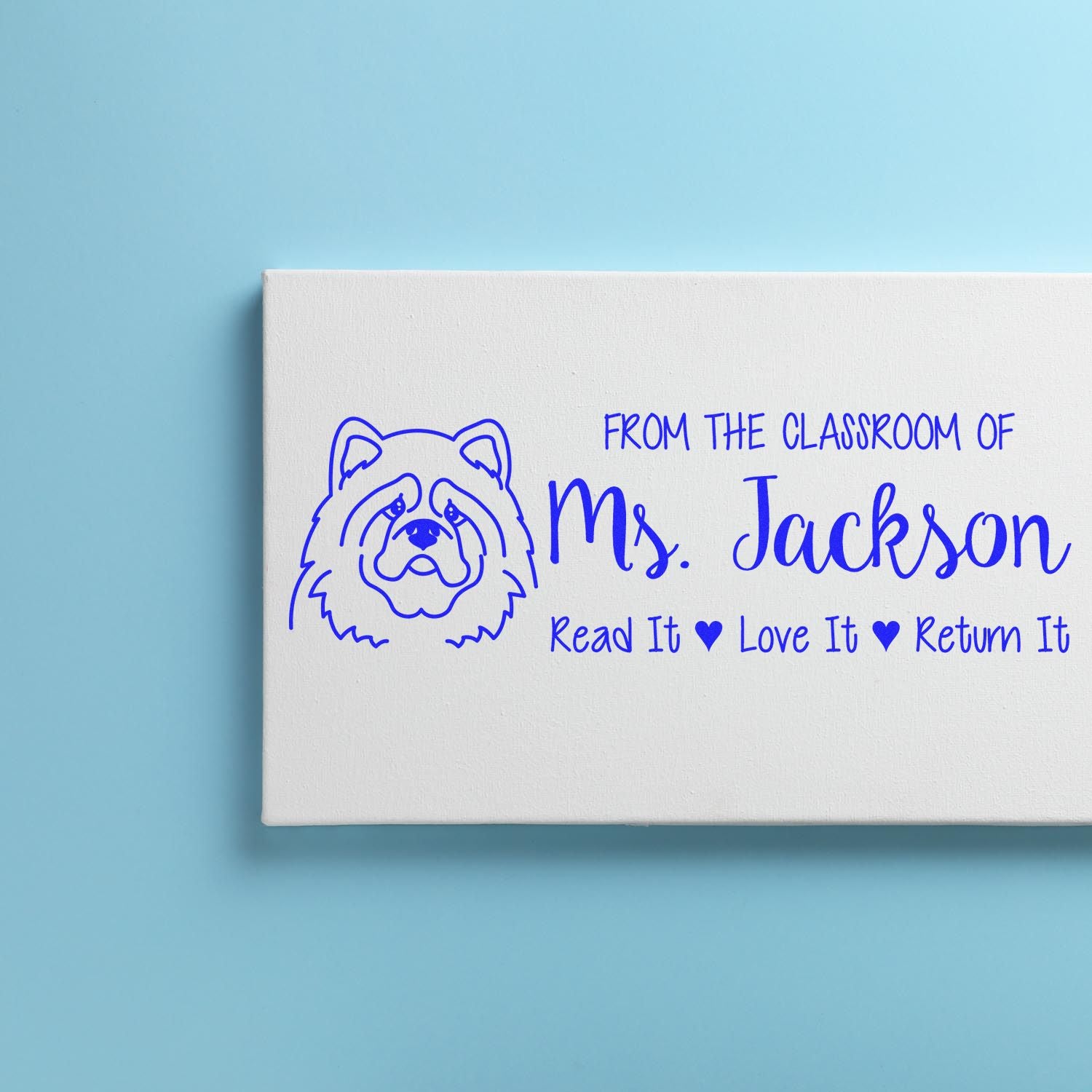 Custom teacher rubber stamp for Ms. Jackson with dog design and Read It, Love It, Return It classroom label.