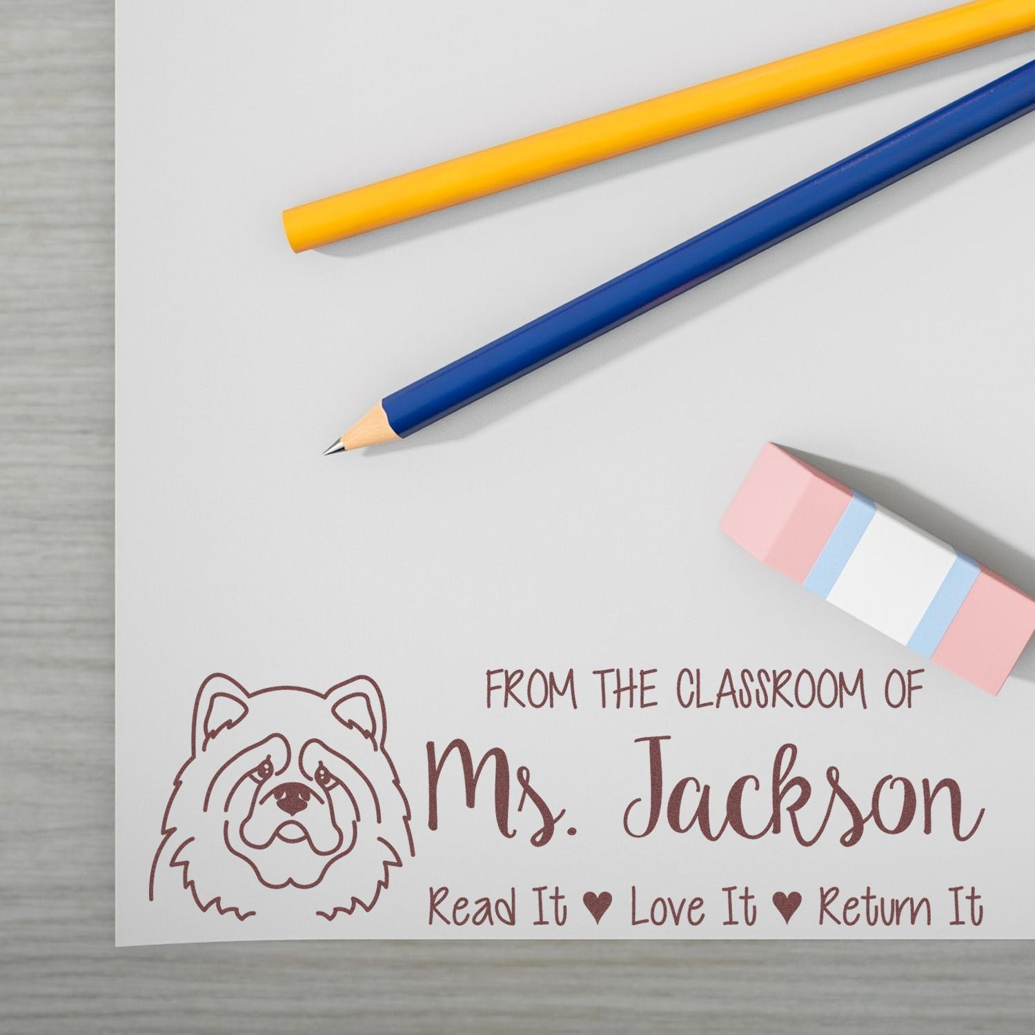 Custom teacher rubber stamp with bear design and Read It, Love It, Return It for classroom book labeling by Ms. Jackson.