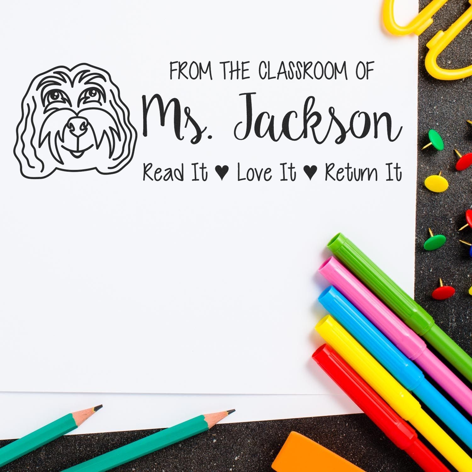 Personalized teacher rubber stamp for Ms. Jackson, featuring a dog graphic and Read It, Love It, Return It message for library books.