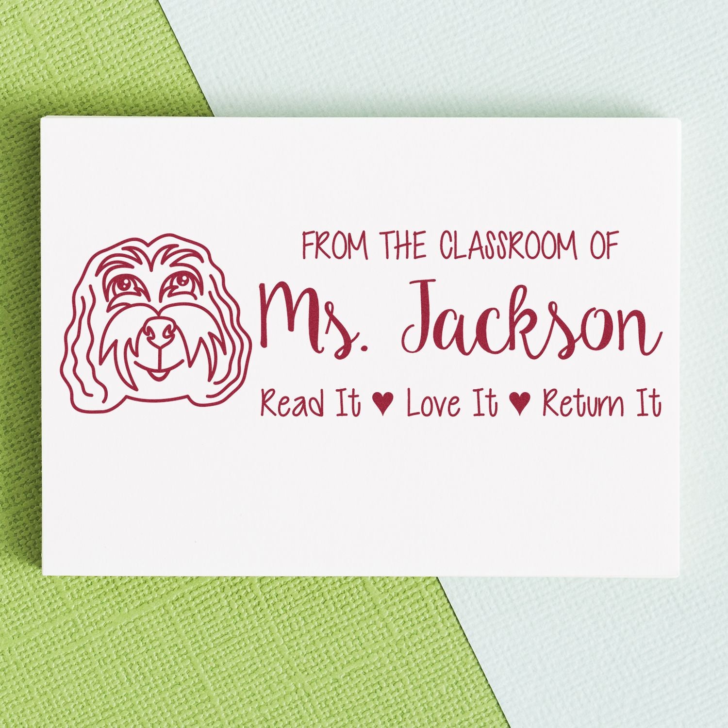 Personalized teacher rubber stamp with dog illustration and classroom book return message: Read It Love It Return It.