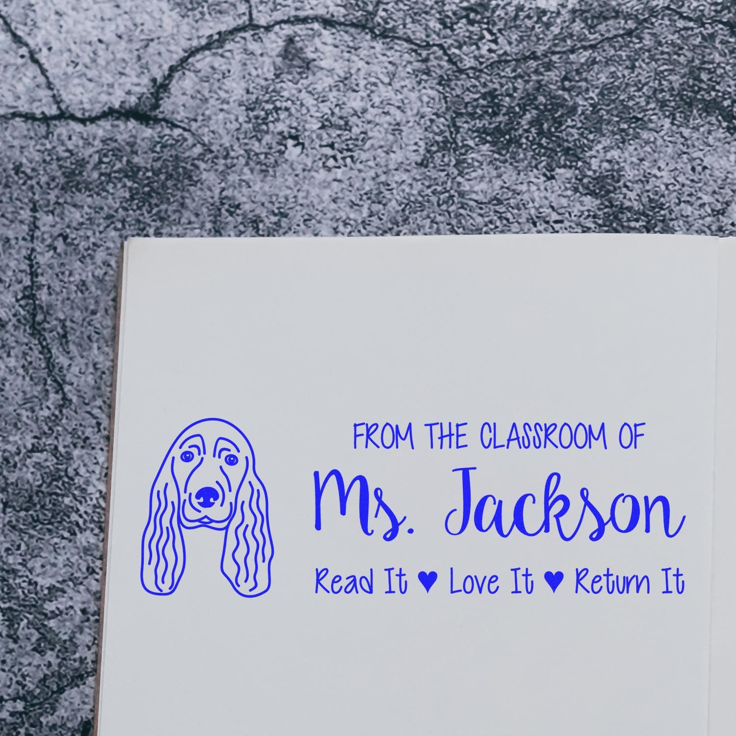 Custom teacher rubber stamp with dog design and classroom book label, Read It Love It Return It, for Ms. Jackson.