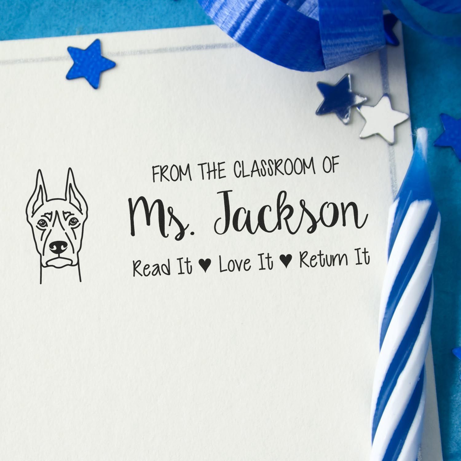 Personalized rubber stamp for Ms. Jacksons classroom library: Read It, Love It, Return It book stamp with dog design.