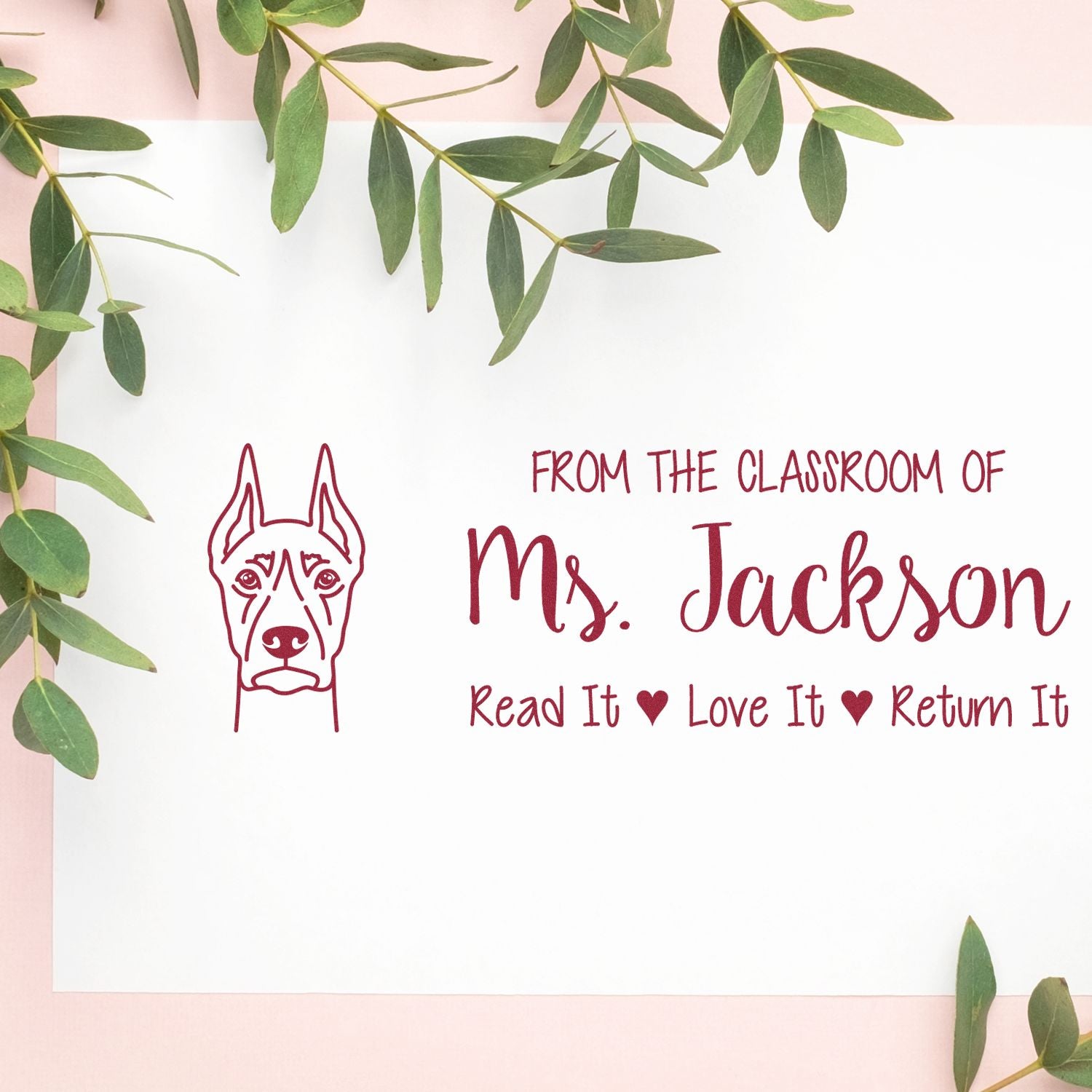 Personalized teacher rubber stamp with dog icon and From the classroom of Ms. Jackson read it, love it, return it book message.