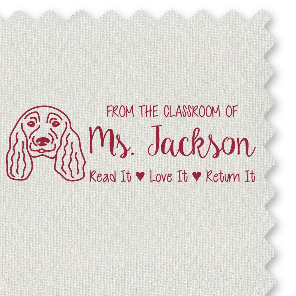 Custom teacher rubber stamp with dog design and Read It, Love It, Return It message for Ms. Jacksons classroom.