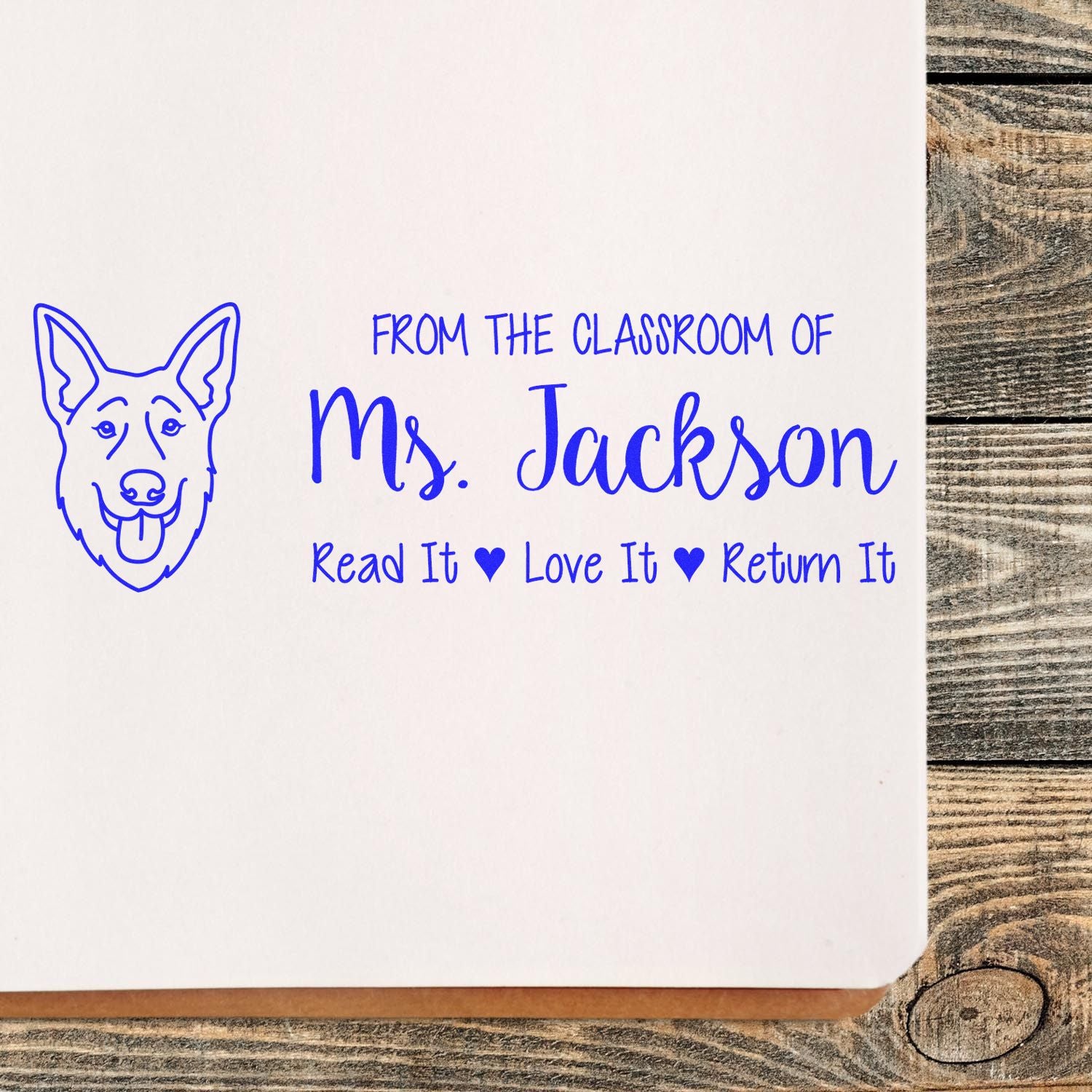 Teacher book stamp for Ms. Jackson with dog mascot: Read It, Love It, Return It classroom library marking.