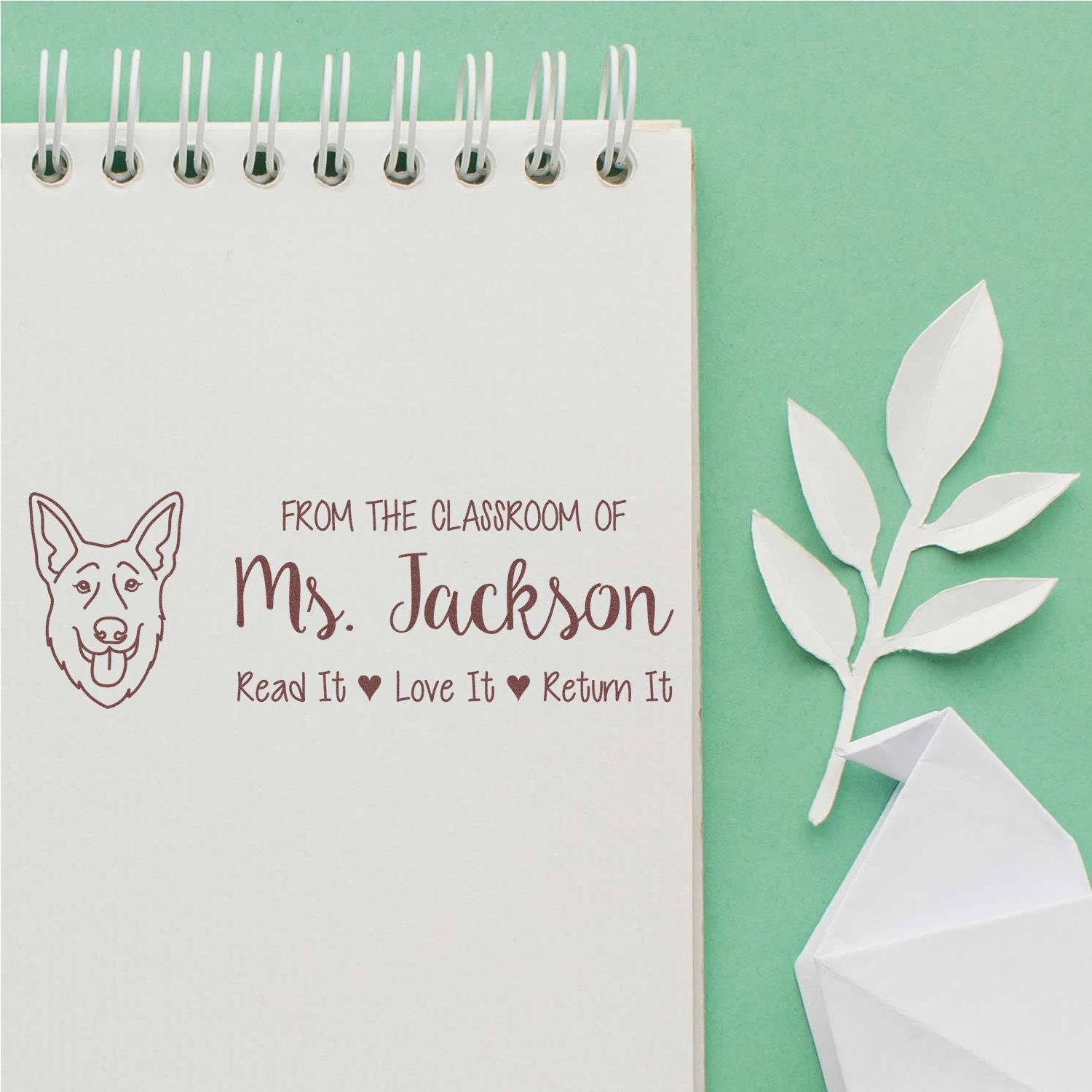 Personalized teacher rubber stamp for classroom books, featuring Ms. Jacksons dog design and Read it, Love it, Return it message.