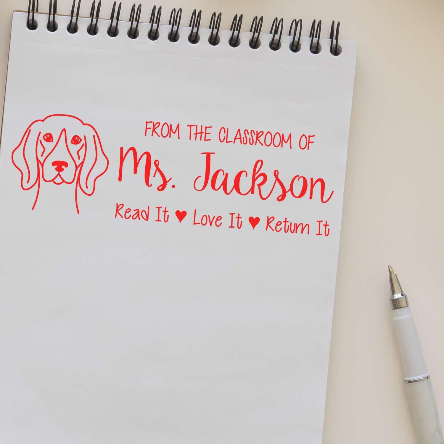 Custom teacher rubber stamp with dog design: From the classroom of Mrs. Jackson, Read It Love It Return It.