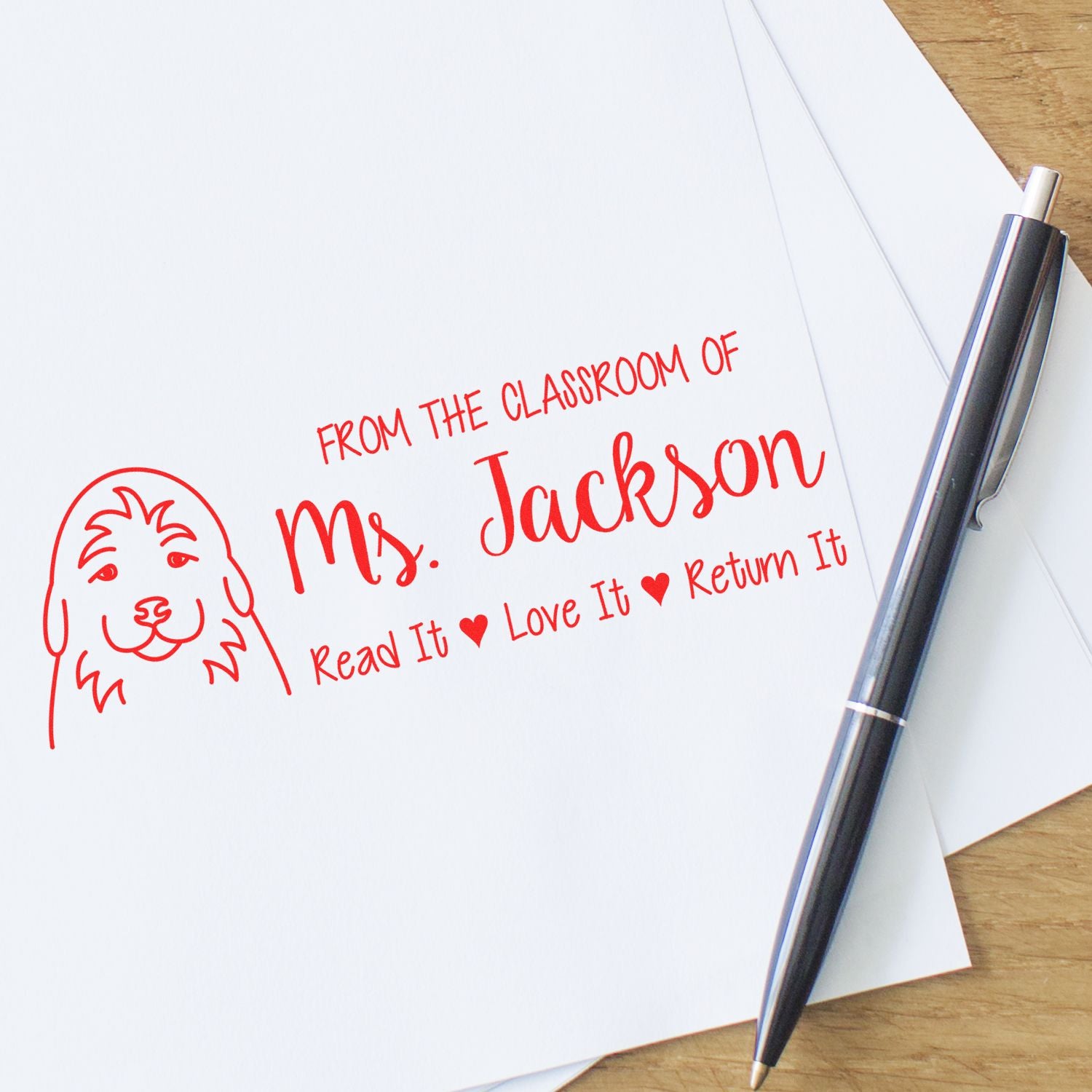 Custom teacher rubber stamp impression on paper, personalized classroom book stamp for Ms. Jackson: Read It, Love It, Return It.