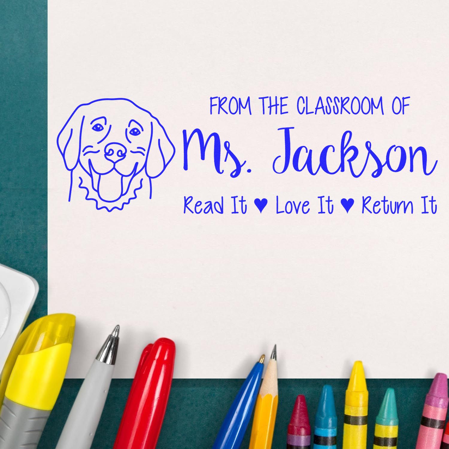 Custom classroom rubber stamp for Ms. Jackson reading From the Classroom of Ms. Jackson, Read It, Love It, Return It with dog icon.
