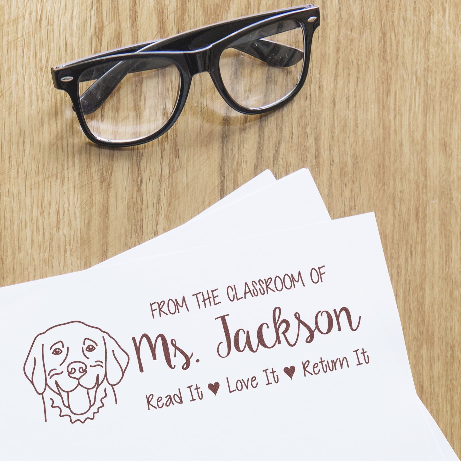 Custom teacher book stamp for Ms. Jackson with dog illustration and Read It, Love It, Return It text.