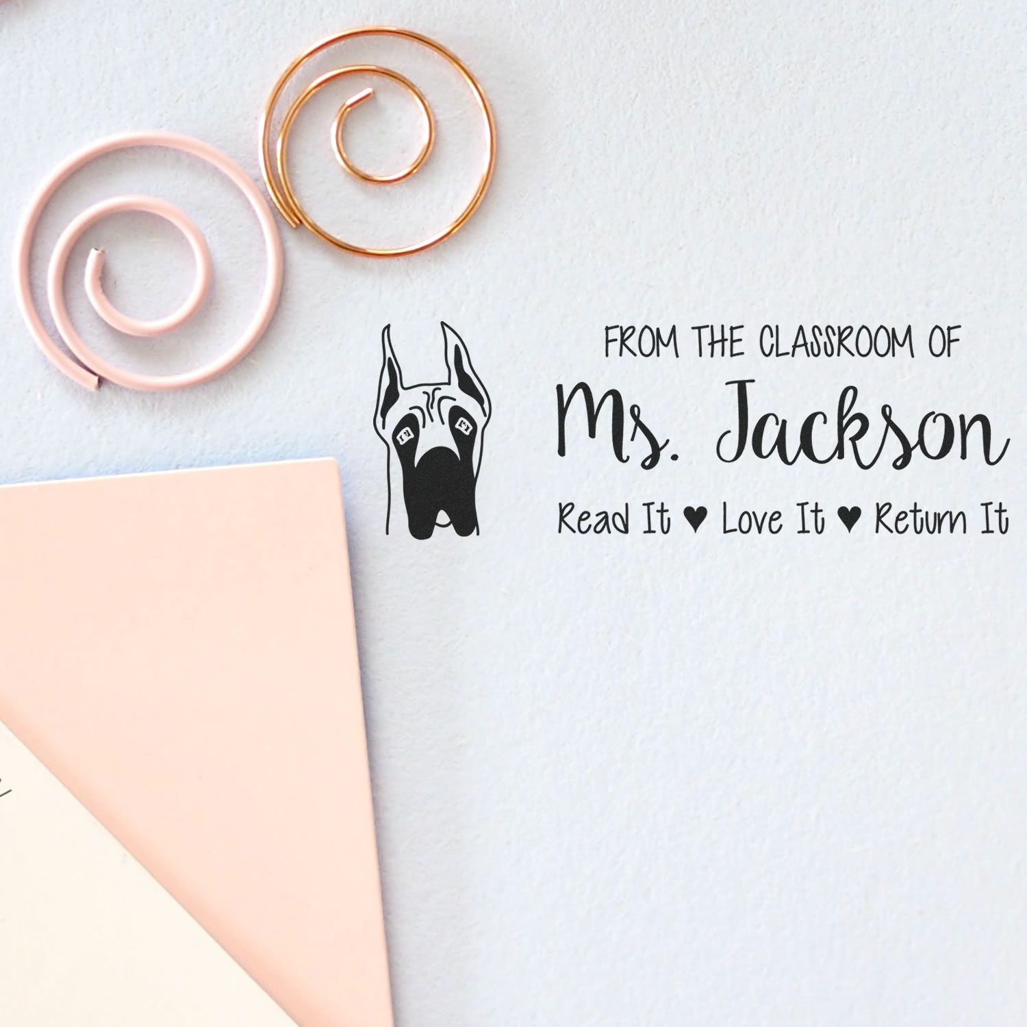 Custom teacher library rubber stamp with dog icon and Read It, Love It, Return It classroom book label.