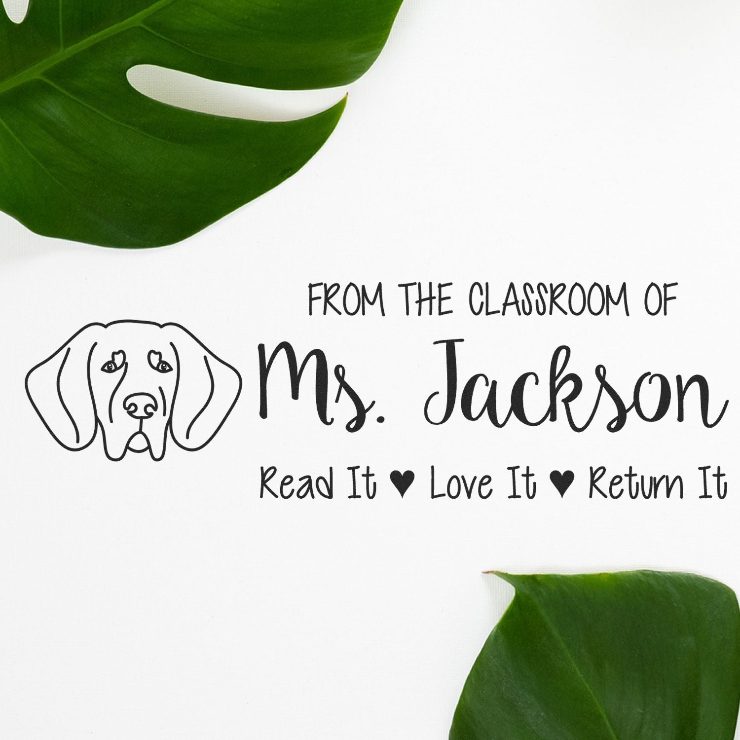 Personalized teacher rubber stamp for Ms. Jackson, featuring dog icon and Read It, Love It, Return It classroom message.
