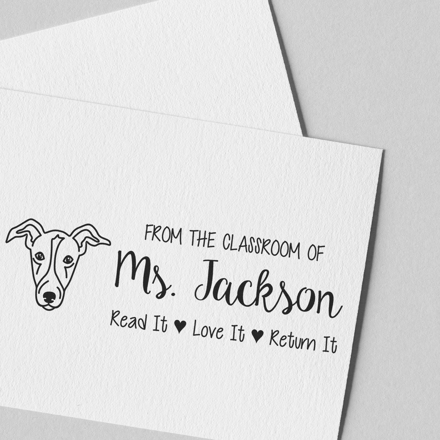 Personalized teacher rubber stamp with dog illustration: From the classroom of Ms. JacksonRead It, Love It, Return It.