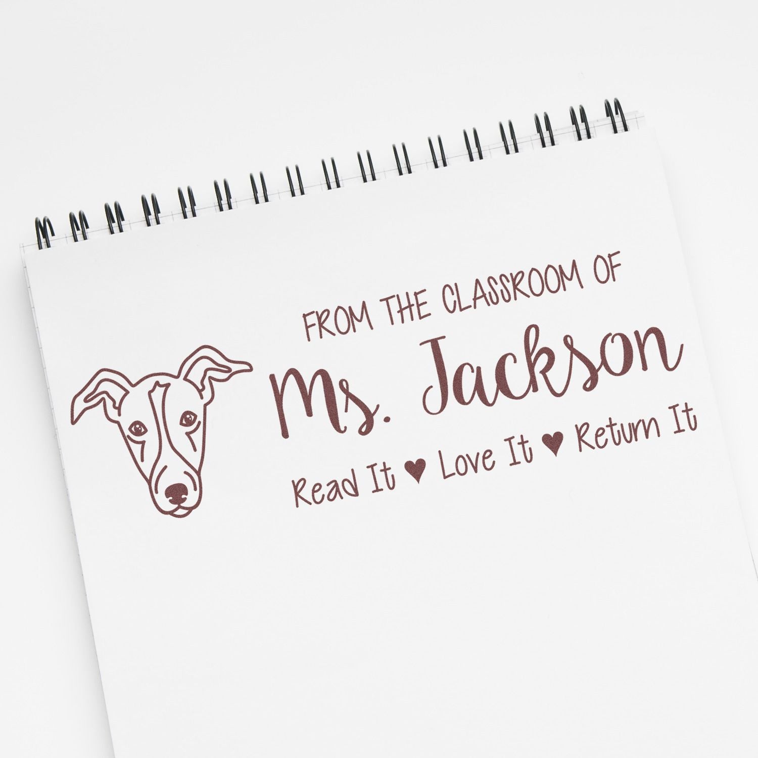 Personalized teacher rubber stamp for classroom books, featuring Ms. Jackson and Read It, Love It, Return It dog design.