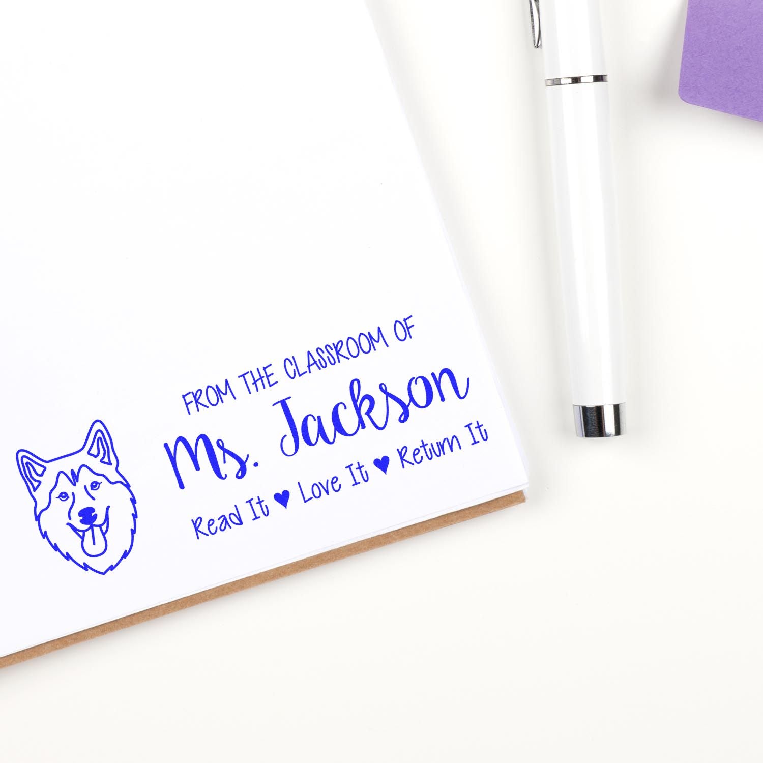 Custom teacher rubber stamp with dog icon and personalized Read It, Love It, Return It classroom book label.