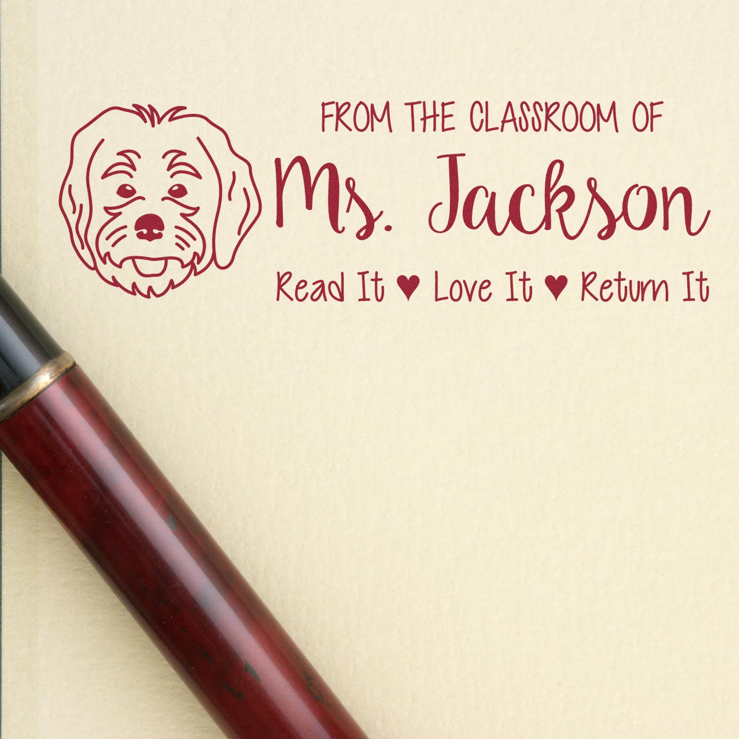 Personalized teacher rubber stamp for Ms. Jackson with dog icon and Read It, Love It, Return It classroom book label.
