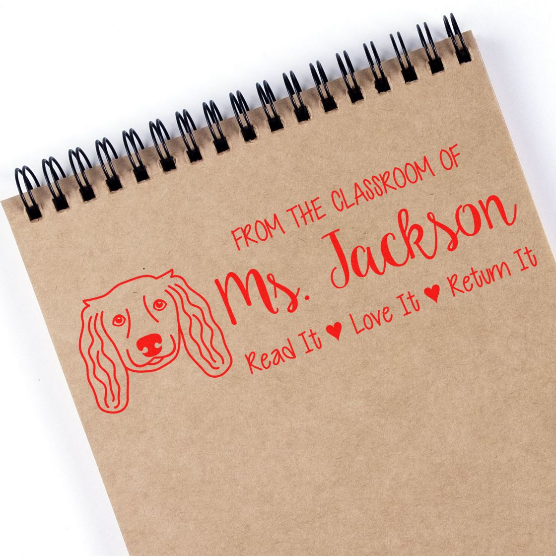Custom classroom book rubber stamp for Ms. Jackson with dog design and Read It, Love It, Return It message.