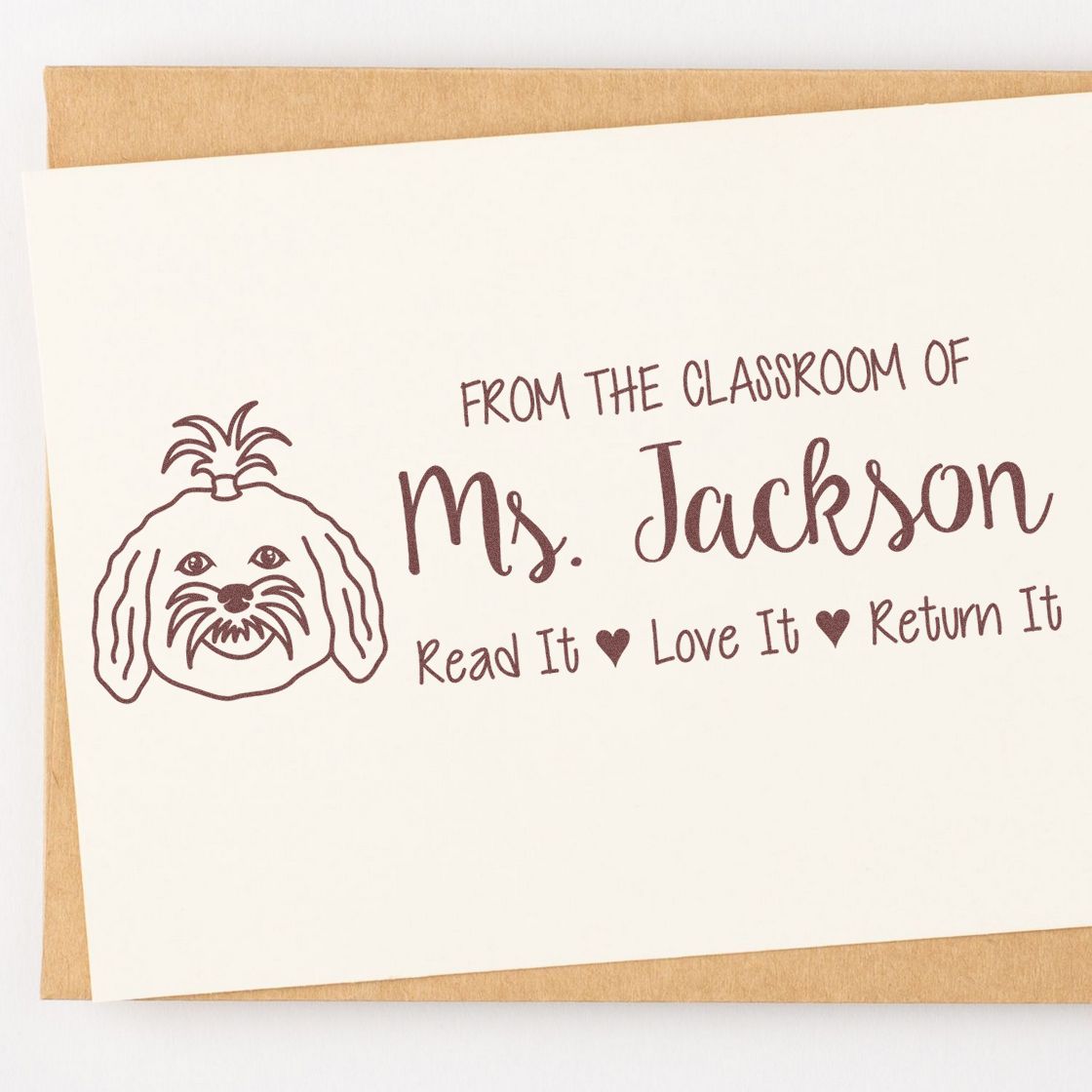 Custom teacher rubber stamp for Ms. Jackson with dog icon and Read it, Love it, Return it classroom book label.