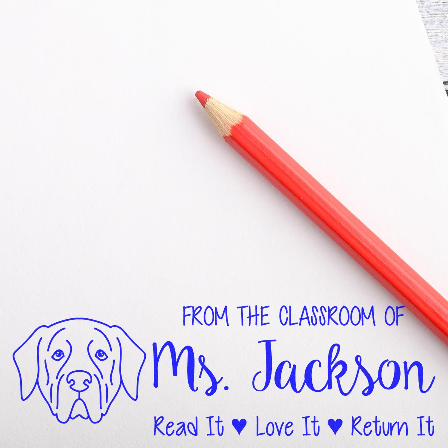 Custom teacher rubber stamp for Ms. Jackson with dog graphic and message: Read it, Love it, Return it.
