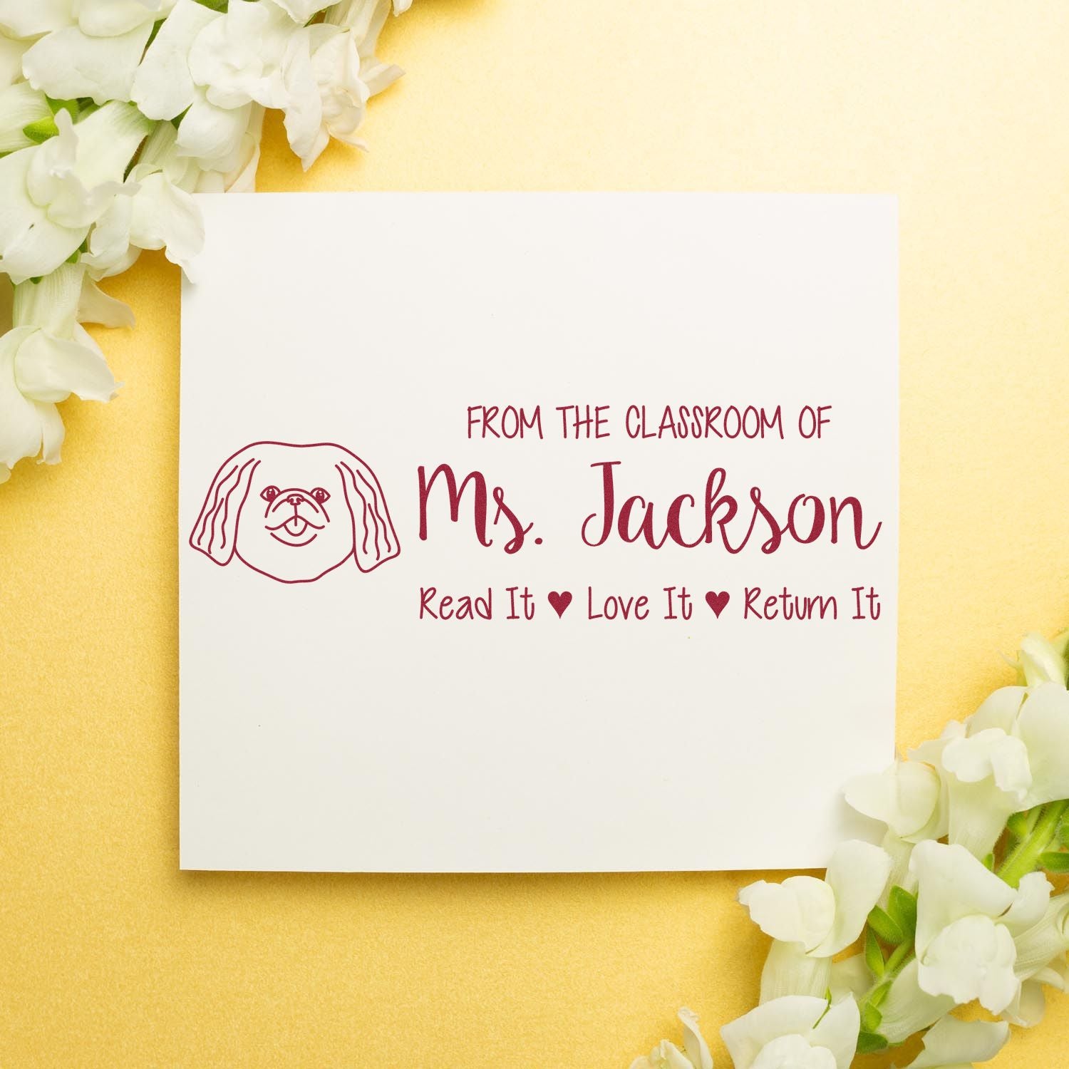 Personalized classroom rubber stamp for Ms. Jackson with dog icon and Read It, Love It, Return It library message.