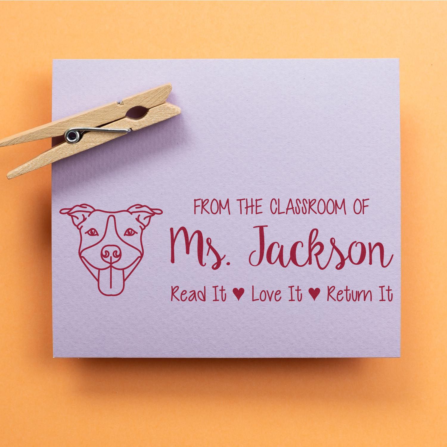 Personalized teacher book stamp with dog design, featuring Ms. Jackson classroom label and Read It, Love It, Return It message.