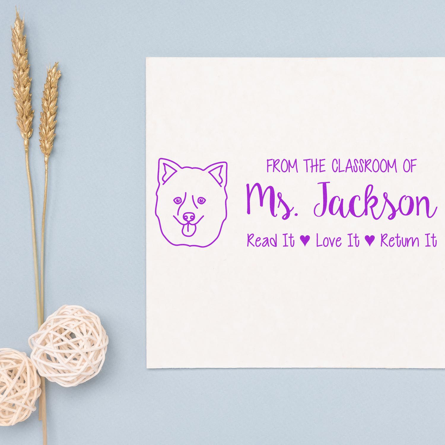 Custom teacher rubber stamp with dog icon and personalized classroom text: From the classroom of Ms. Jackson, Read it, Love it, Return it.