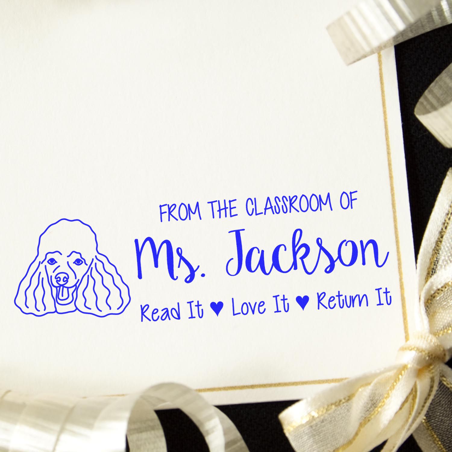 Personalized classroom rubber stamp for Ms. Jackson with poodle icon and Read it, Love it, Return it message.