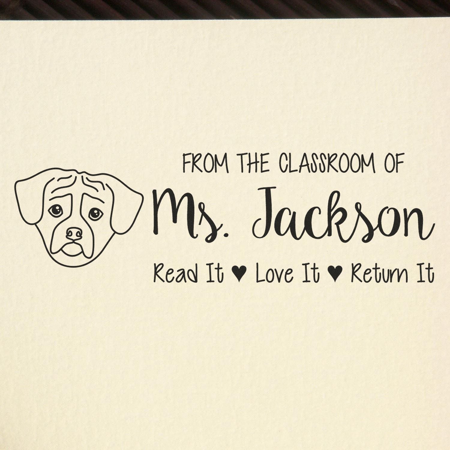 Personalized teacher book stamp with dog illustration: From the Classroom of Ms. Jackson, Read It Love It Return It.