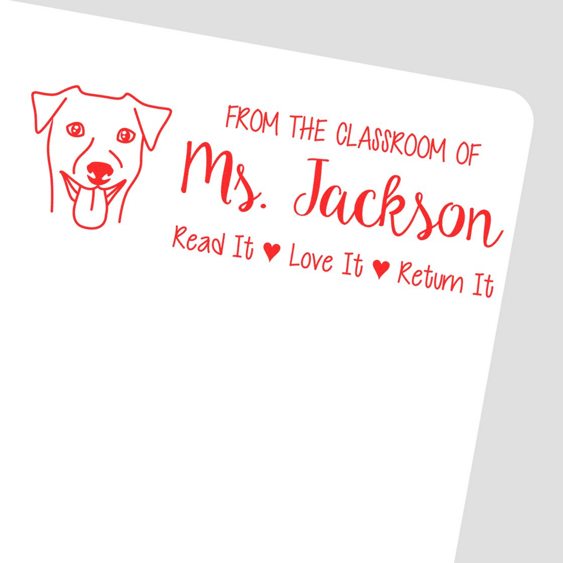 Custom classroom rubber stamp for Ms. Jackson with dog icon and Read it Love it Return it book return message.