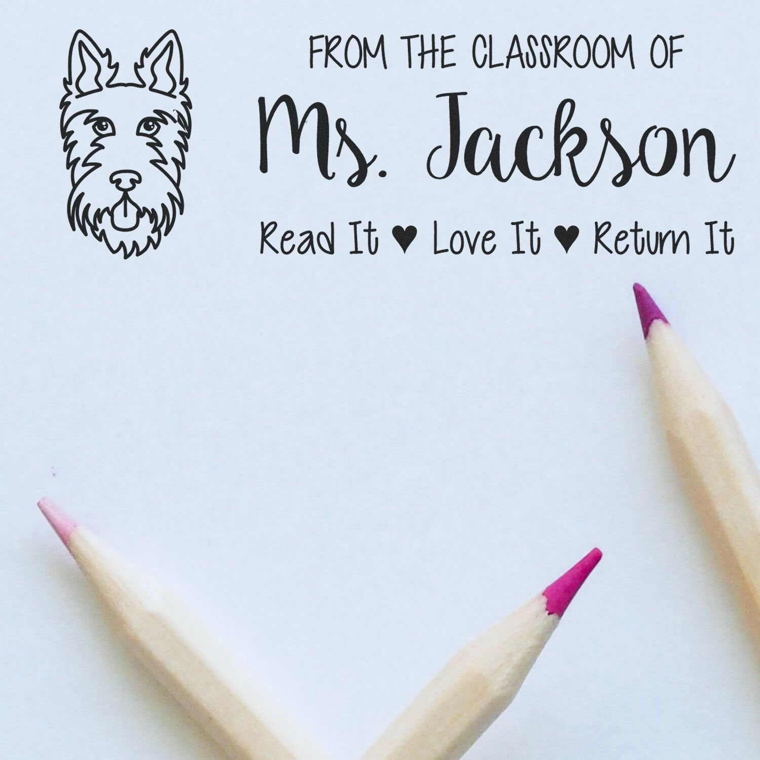 Personalized classroom rubber stamp for Ms. Jackson, featuring a dog icon and Read It, Love It, Return It book label.