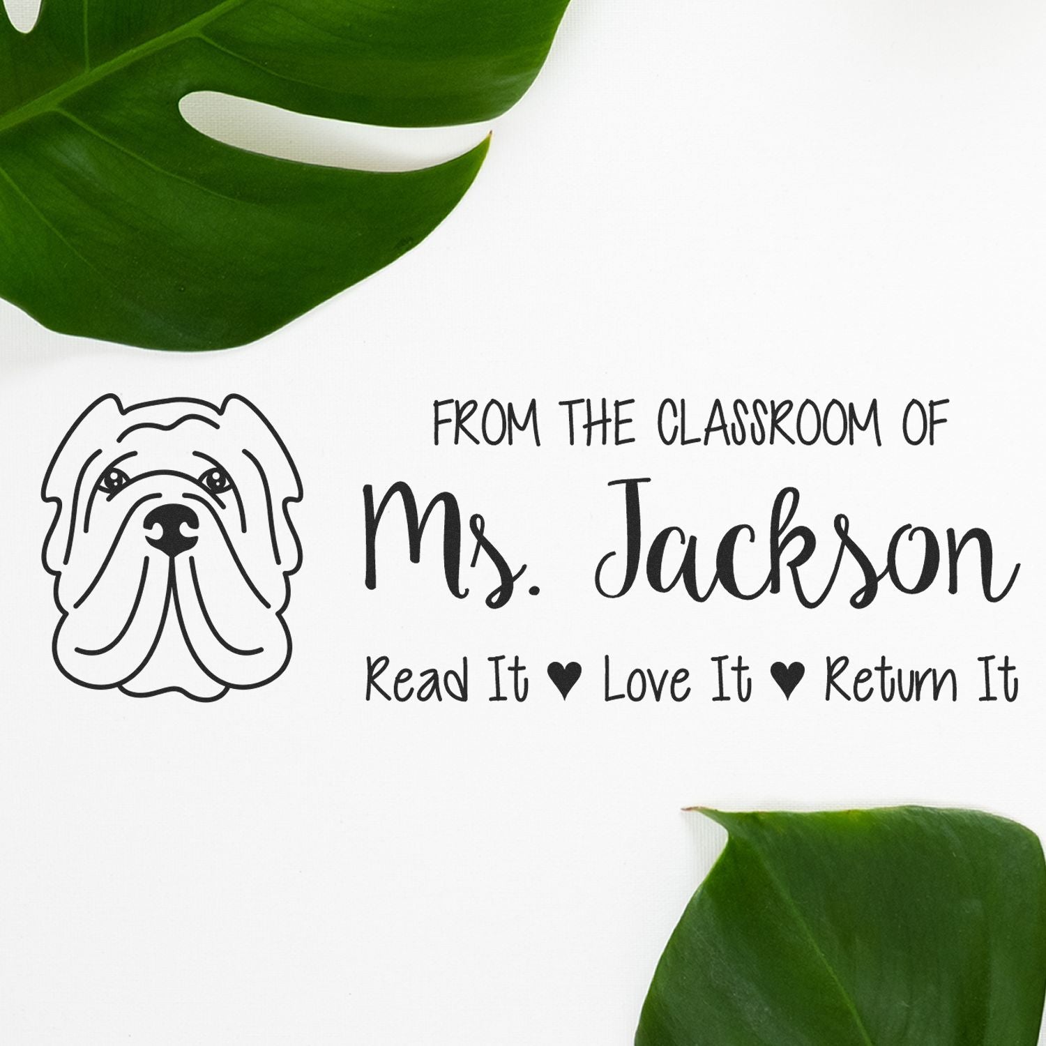 Custom teacher rubber stamp with dog design and From the Classroom of Ms. Jackson Read It, Love It, Return It message.