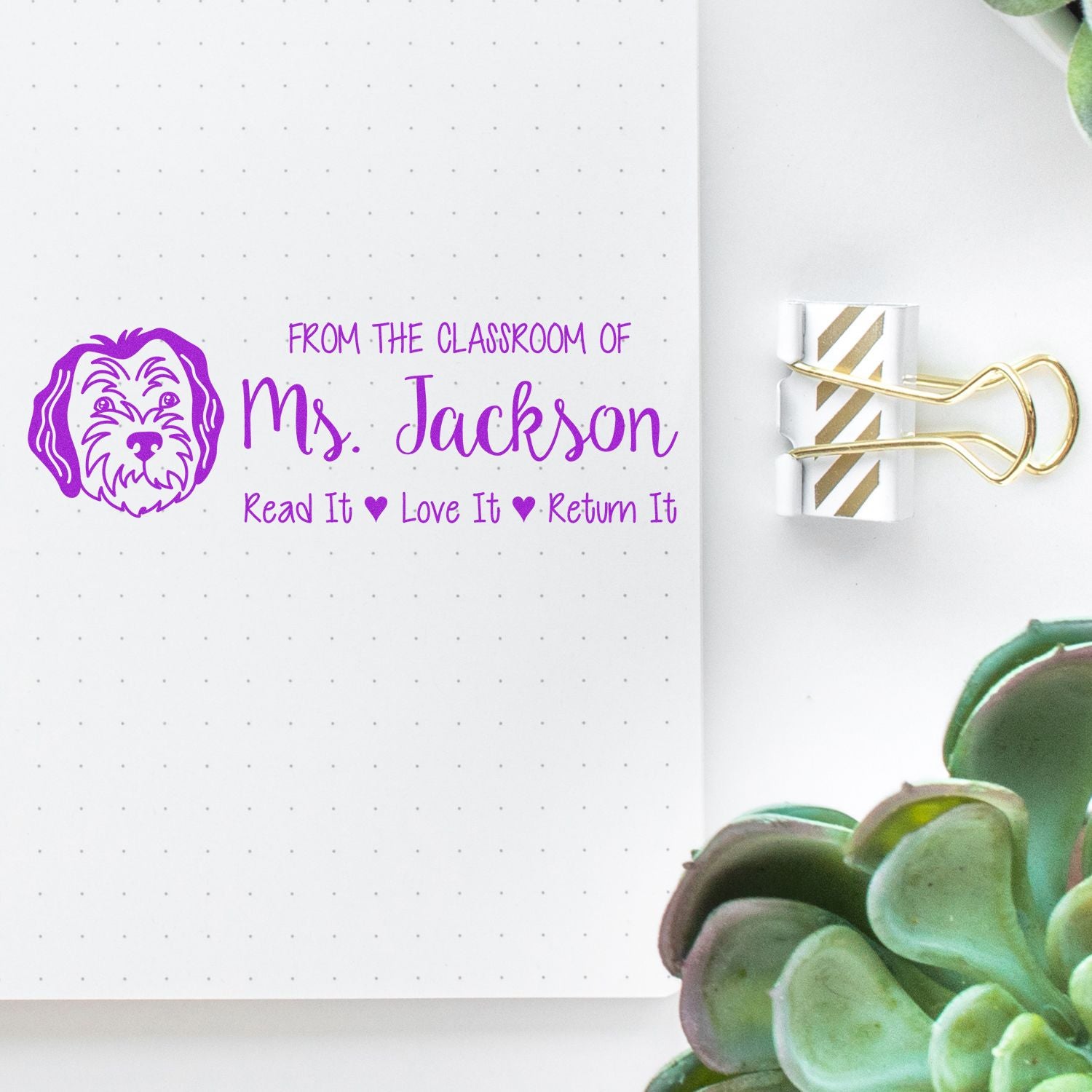 Personalized teacher rubber stamp for classroom library books, with dog icon and Read It, Love It, Return It text.