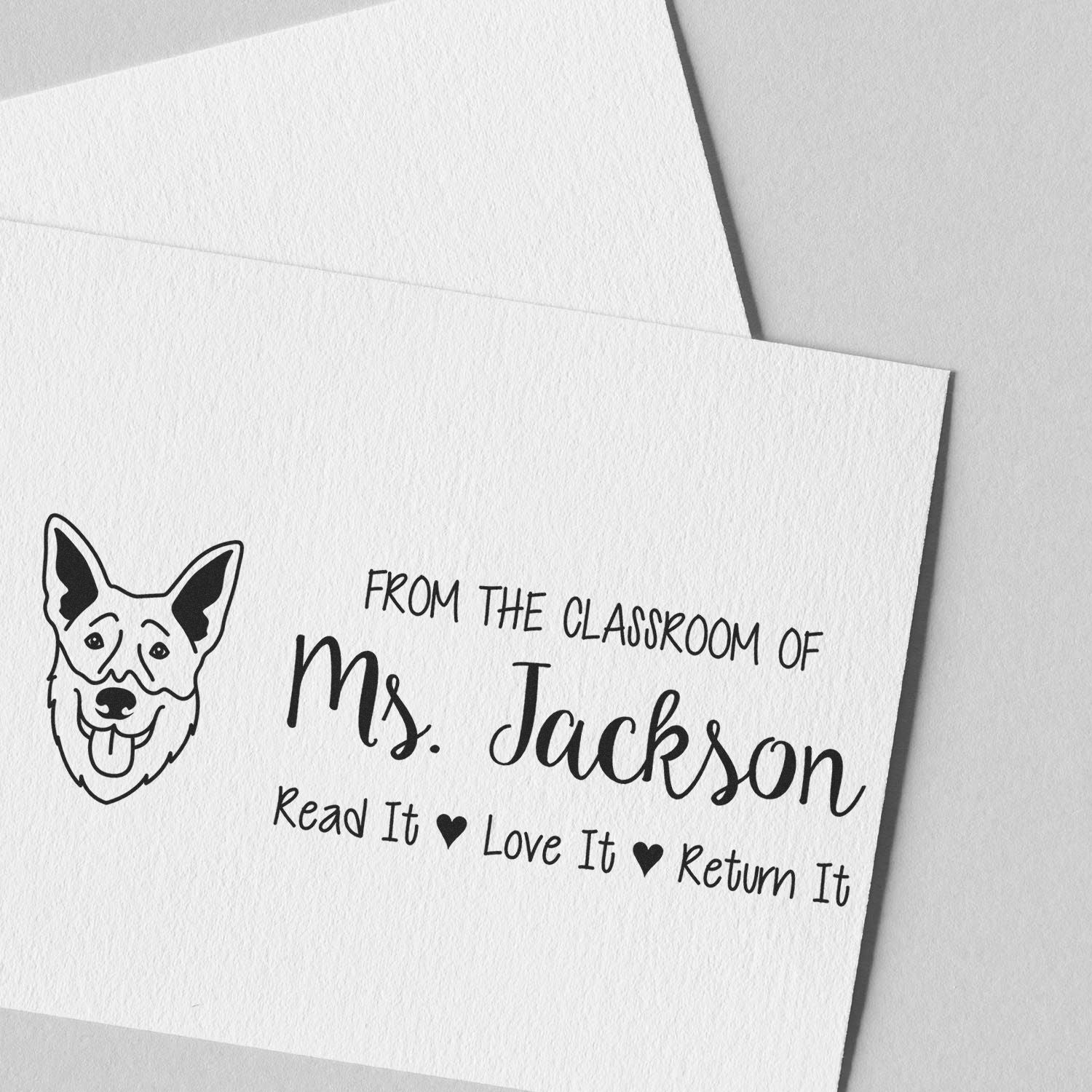 Custom teacher rubber stamp with dog icon and personalized From the classroom of Ms. JacksonRead it, Love it, Return it message.
