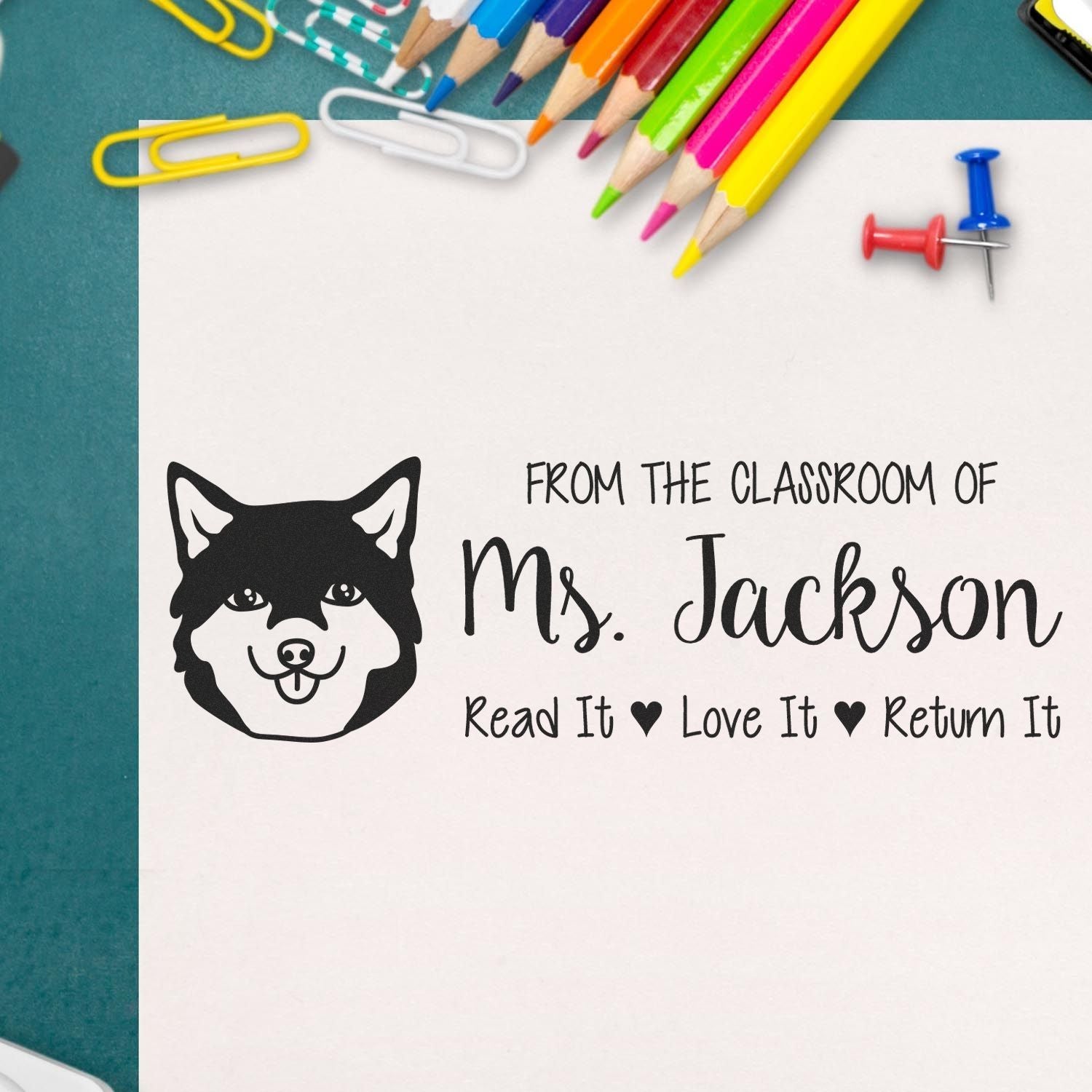 Personalized classroom rubber stamp for Ms. Jackson with dog icon and Read It, Love It, Return It book label.