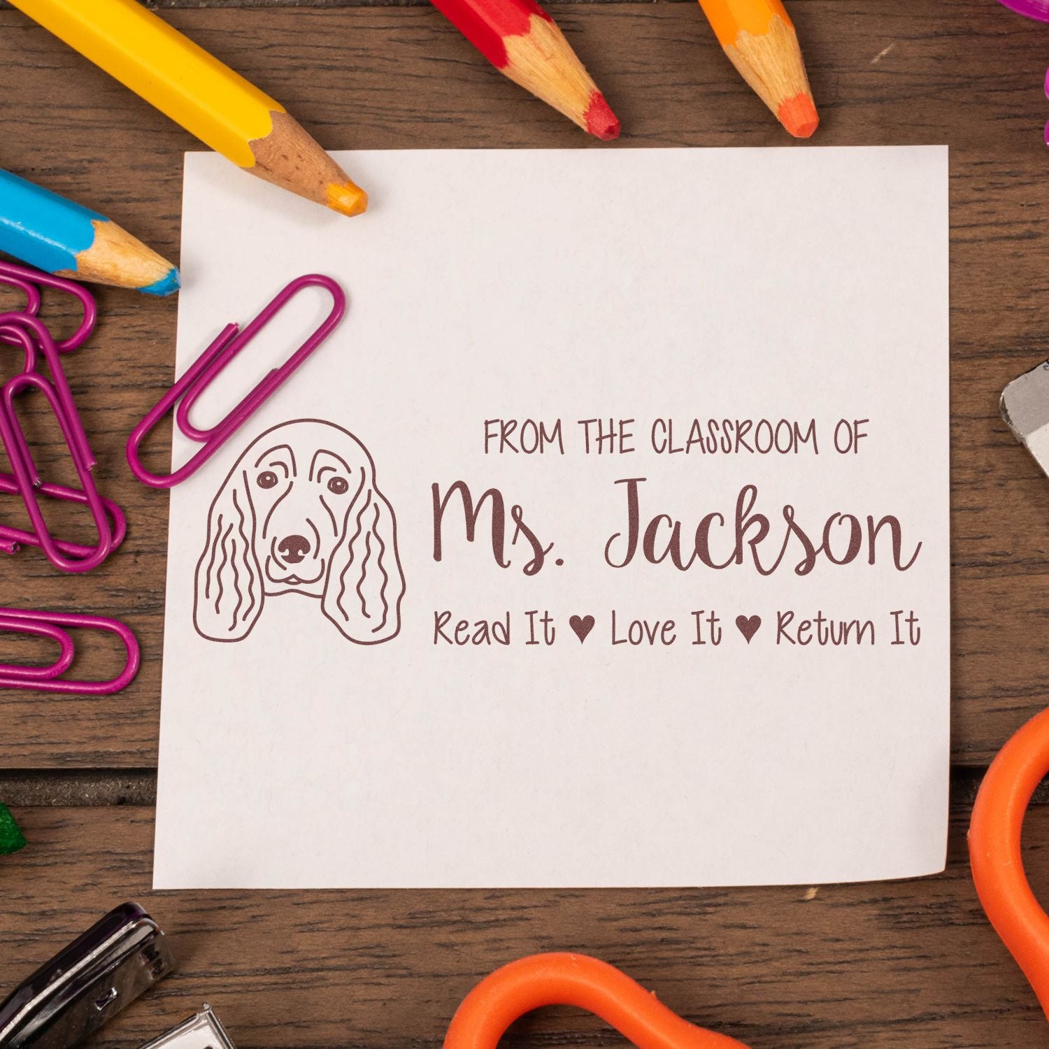 Custom classroom rubber stamp with dog illustration and personalized From the classroom of Ms. Jackson, Read It Love It Return It text