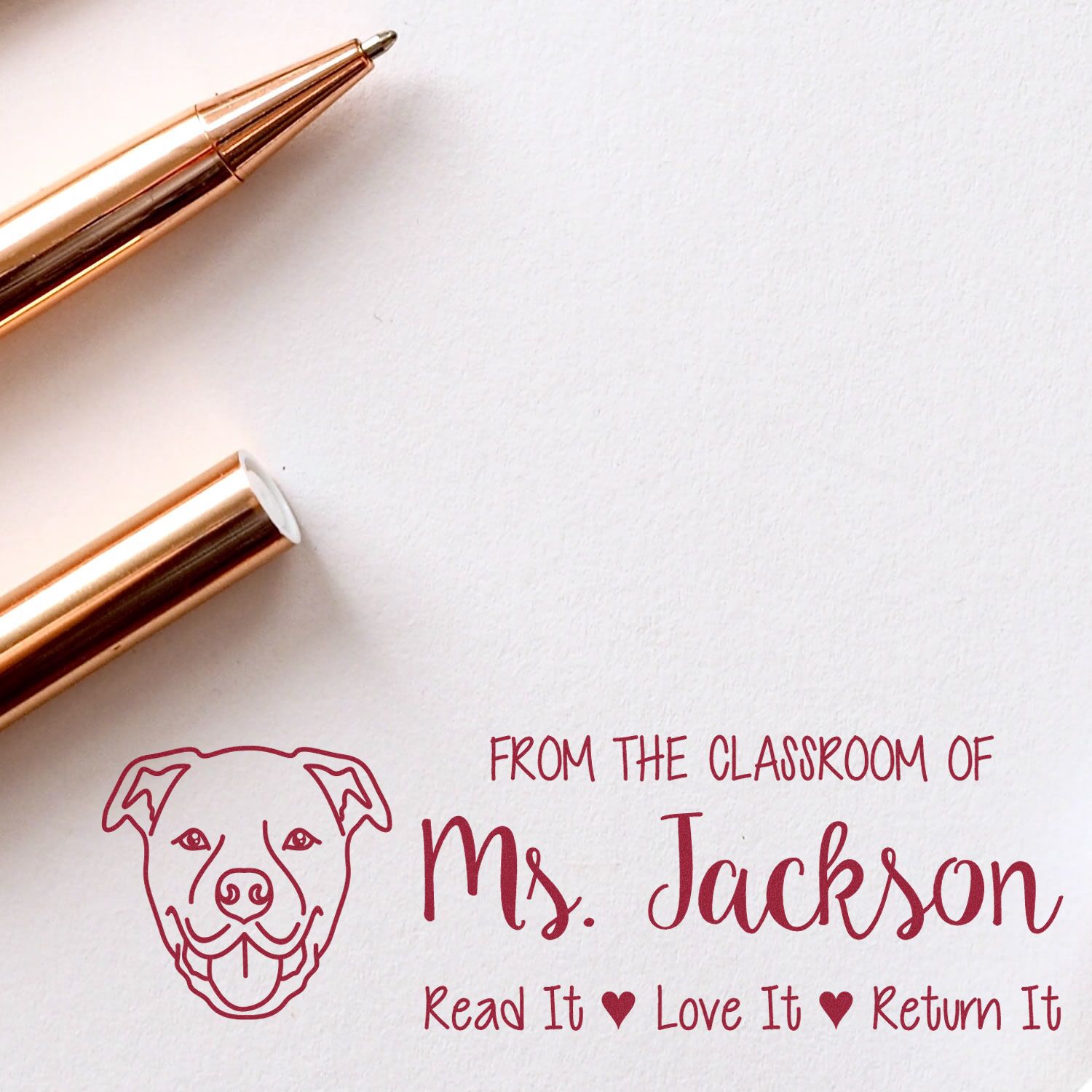 Custom classroom rubber stamp with dog icon and From the Classroom of Ms. Jackson  Read It, Love It, Return It personalized text.