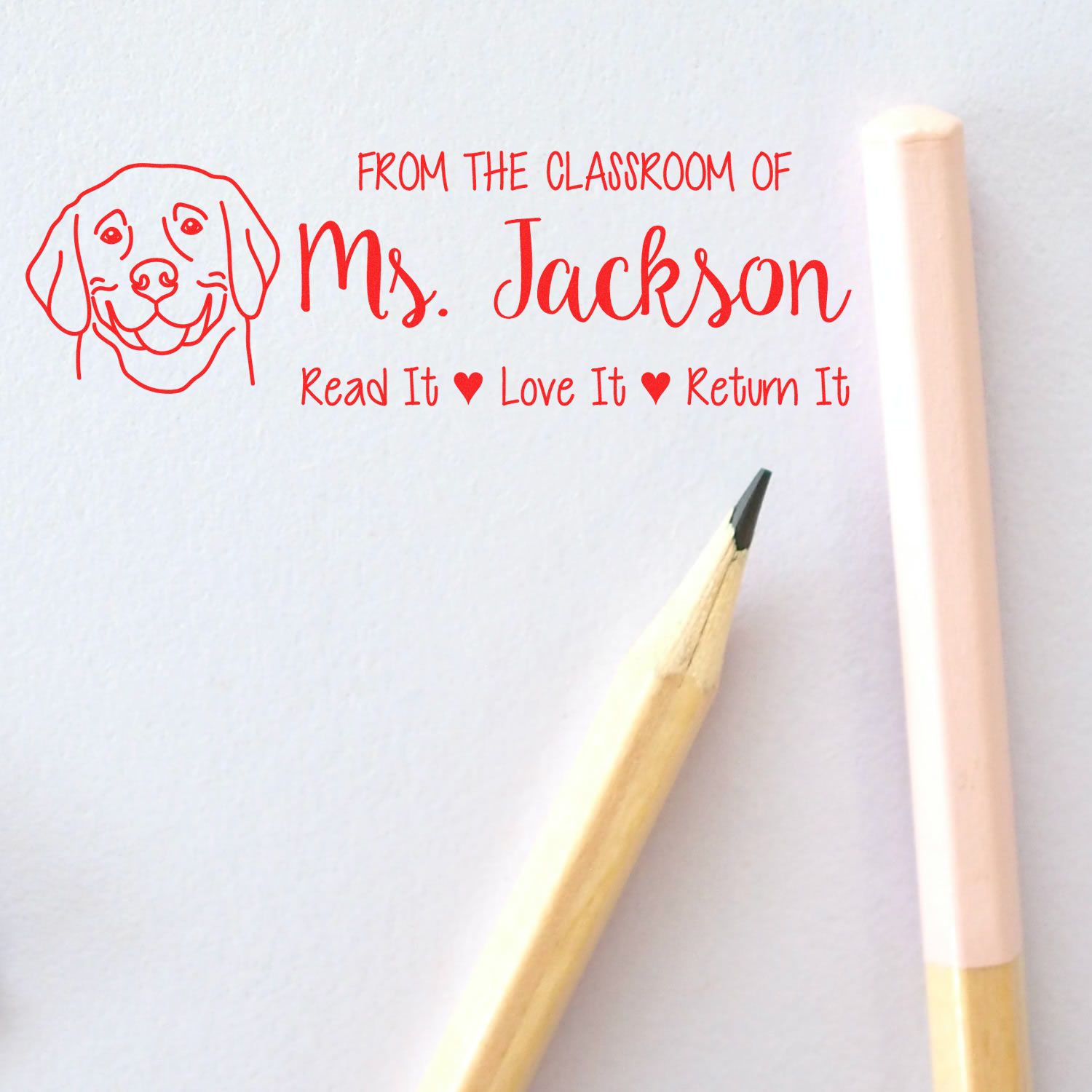 Personalized teacher library book stamp for Ms. Jackson with dog graphic and Read It, Love It, Return It message.