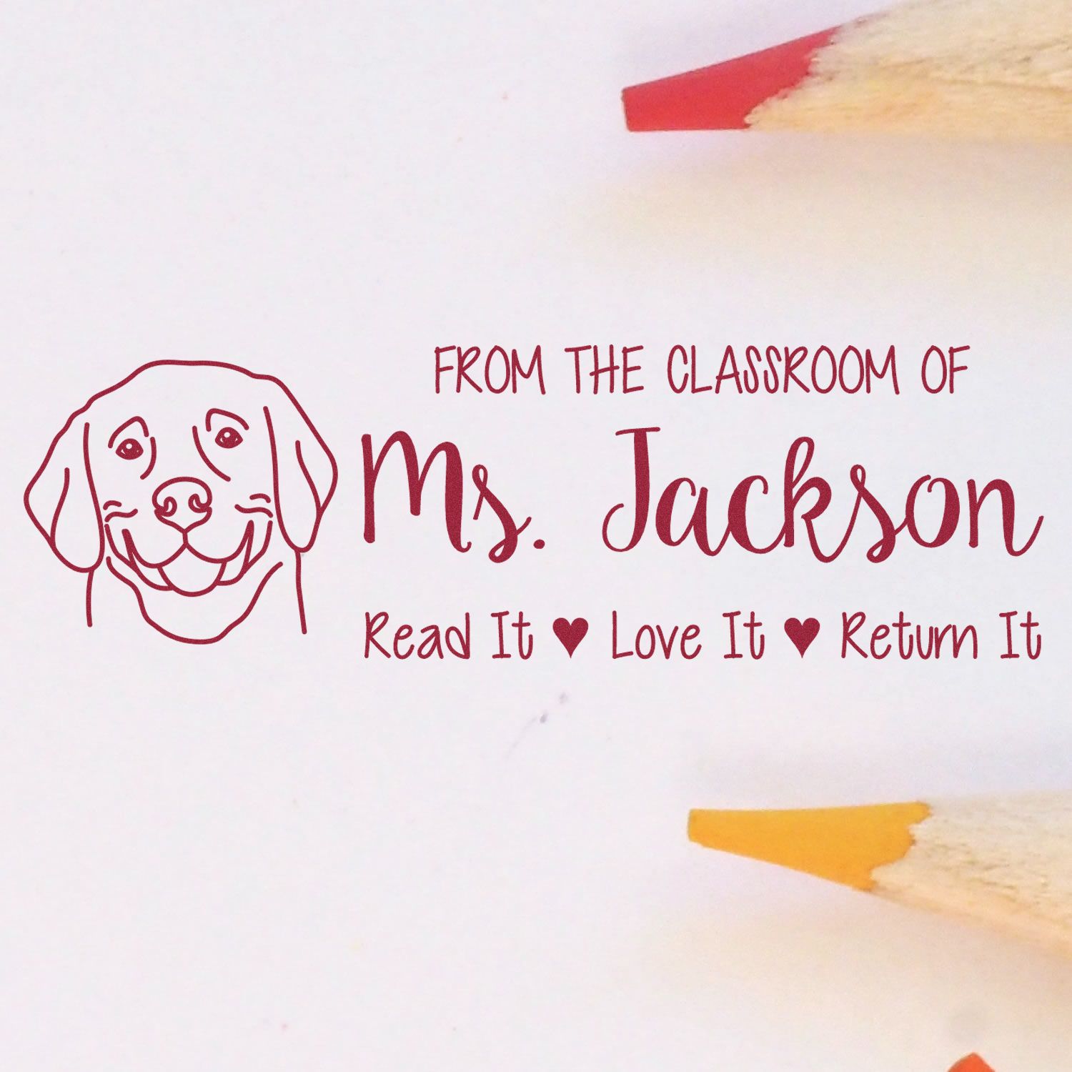 Custom teacher rubber stamp with dog icon and classroom message: From the Classroom of Ms. JacksonRead It, Love It, Return It.