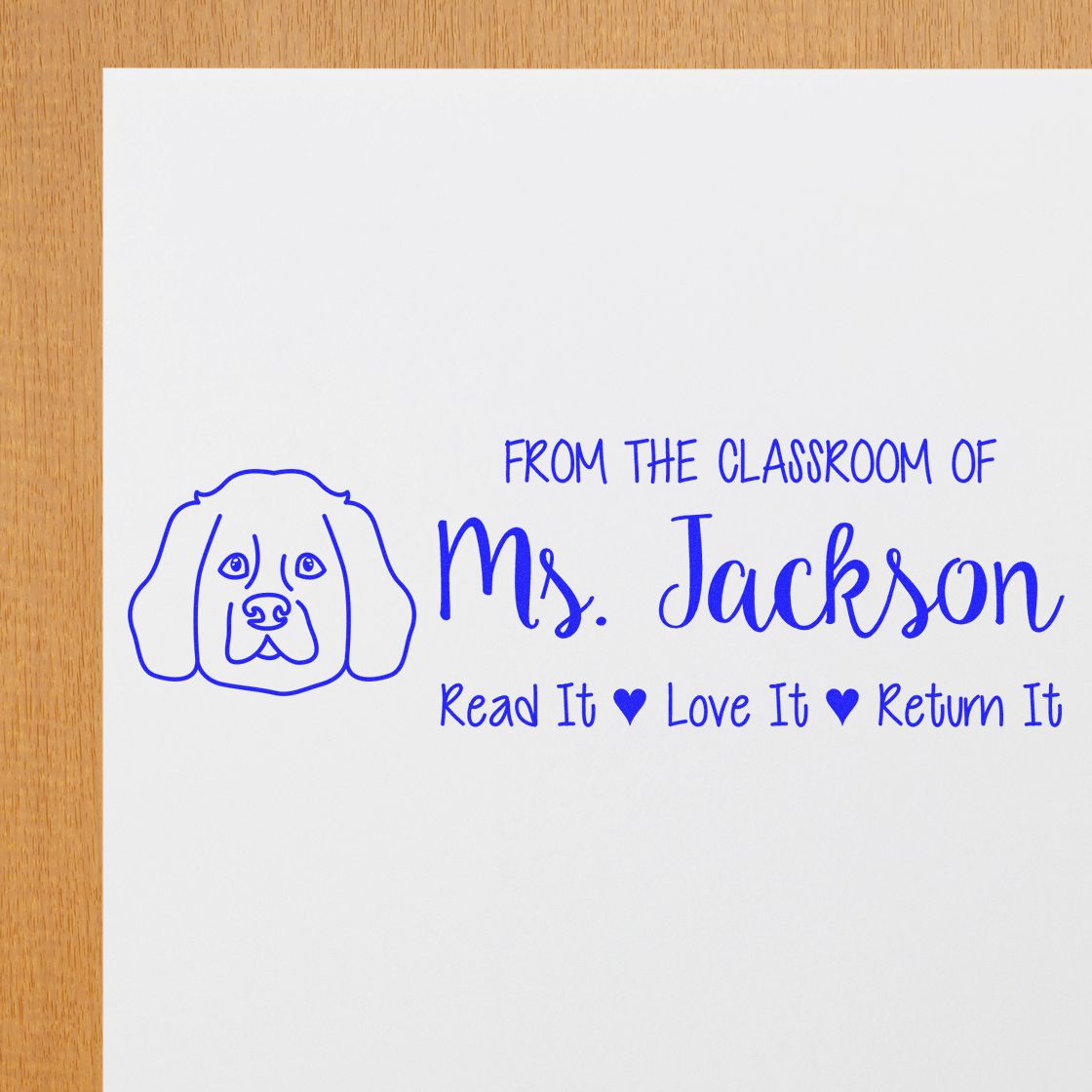 Custom teacher rubber stamp with dog icon and book return message: From the Classroom of Ms. Jackson, Read It Love It Return It.