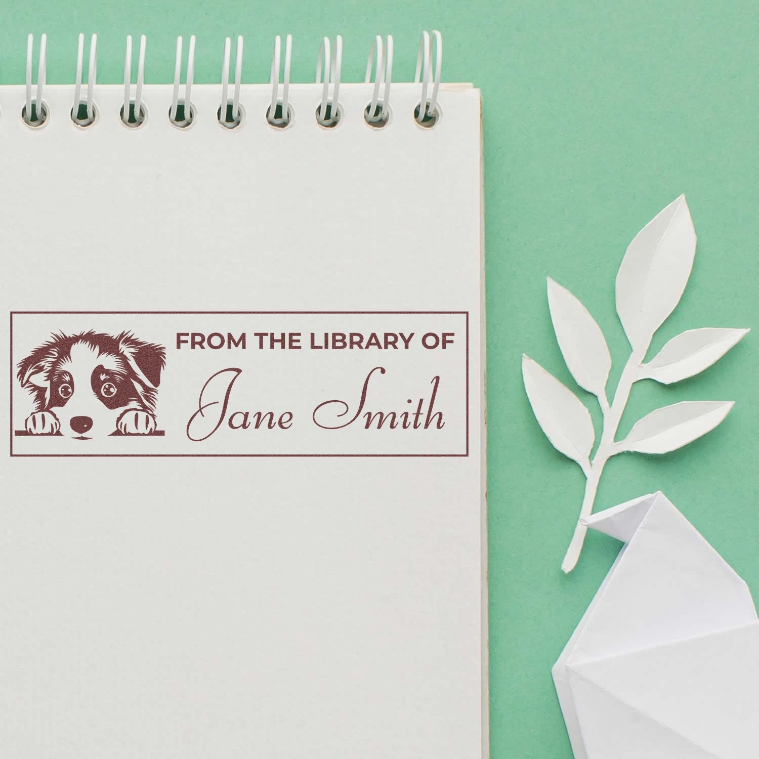 Custom rubber stamp with dog art and From the Library of Jane Smith for personalized bookplates, books, and stationery.