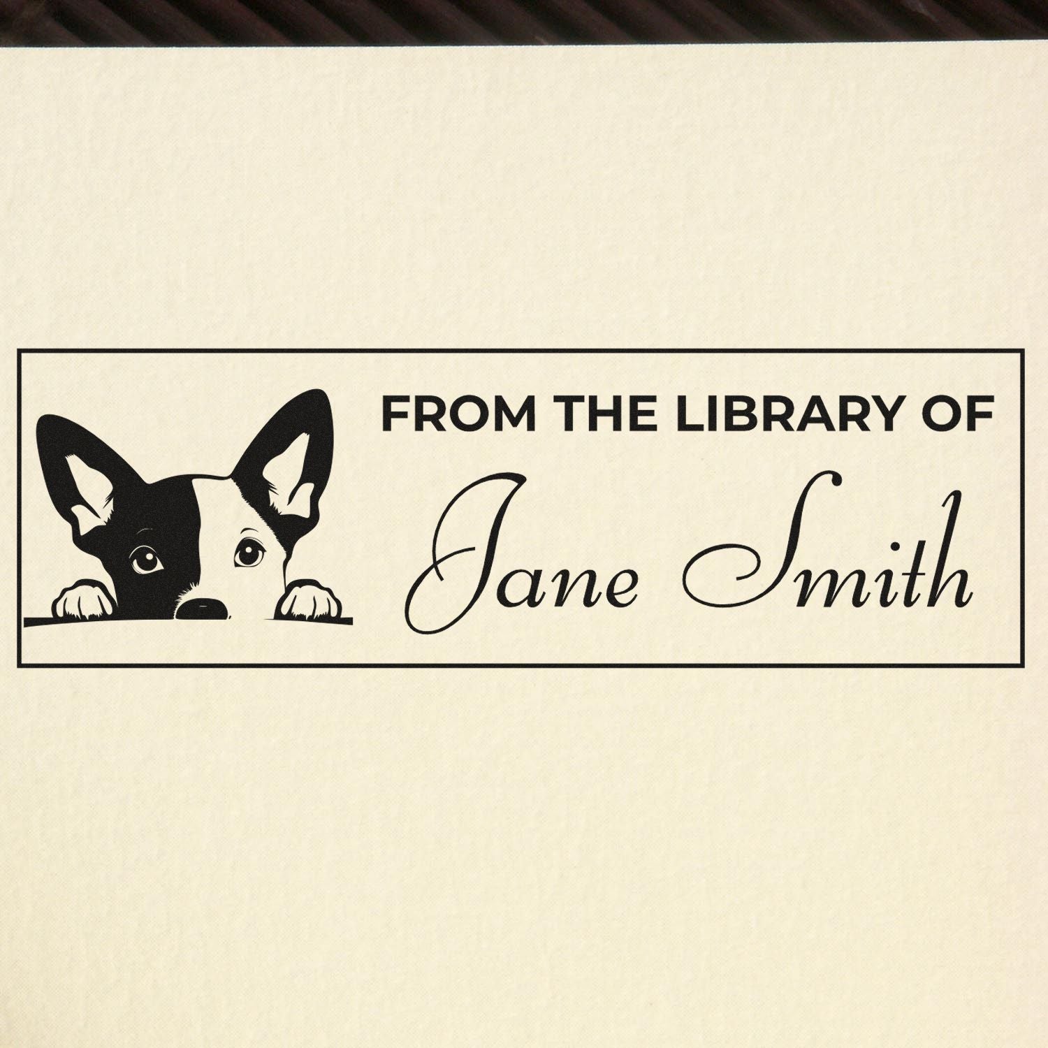 Personalized dog bookplate rubber stamp reading From the Library of Jane Smith for custom book labeling.