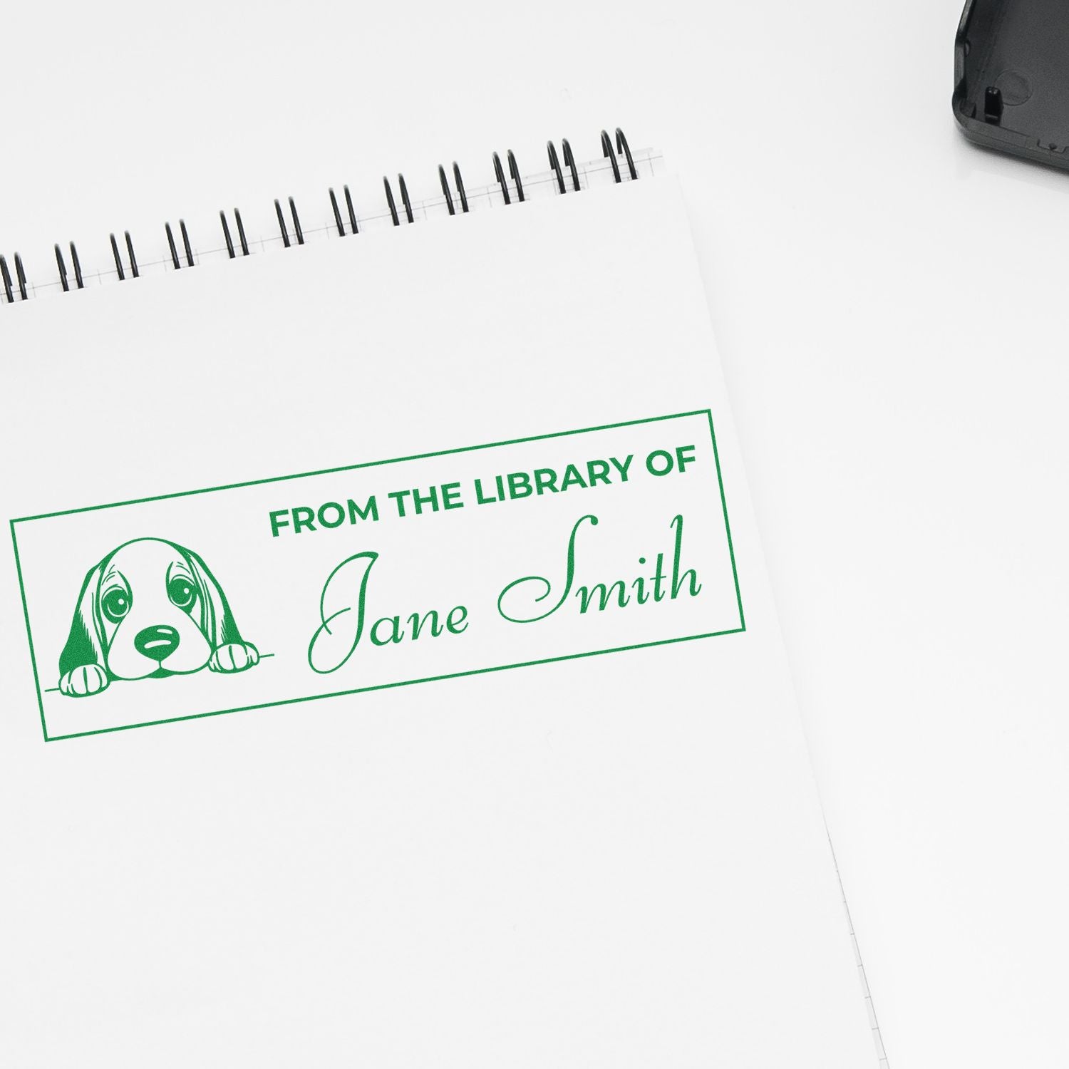 Custom library book rubber stamp with dog design and Jane Smith name for personalized book labeling.