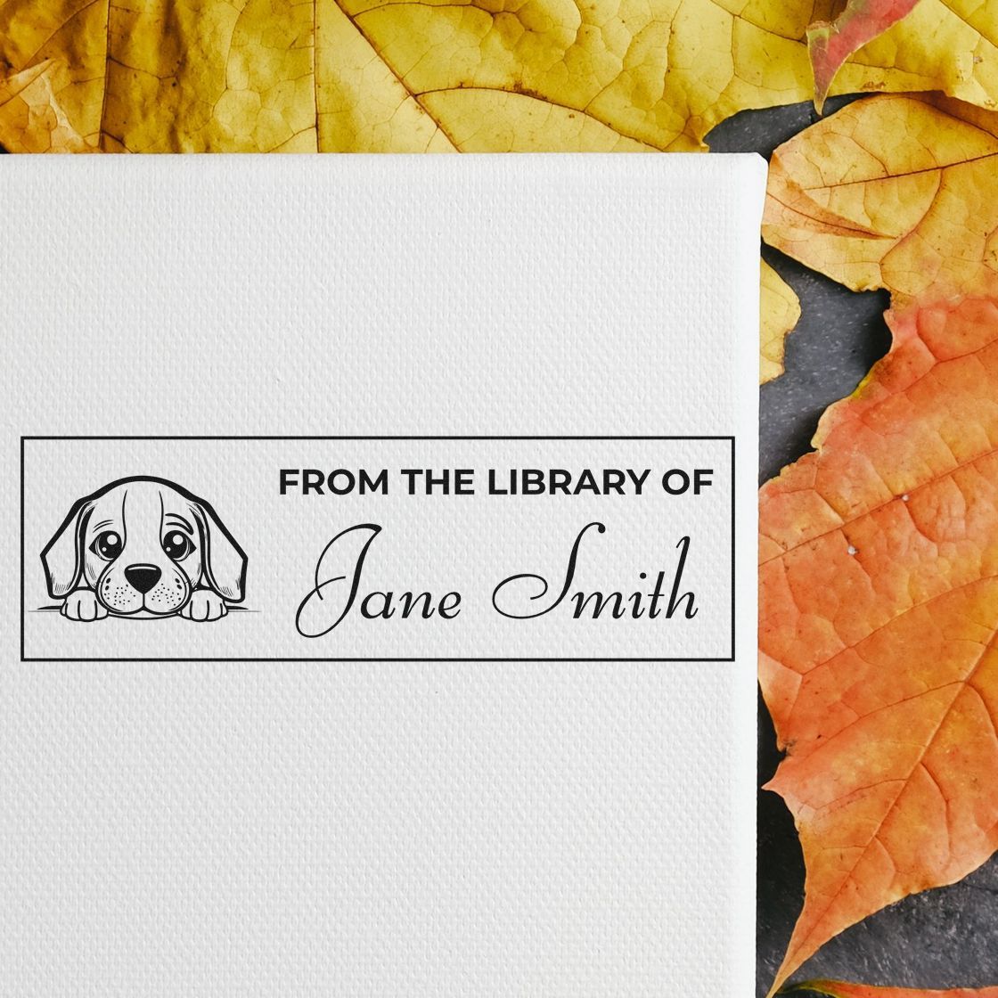 Custom rubber stamp with dog illustration and From the Library of Jane Smith text for personalized books and library items.
