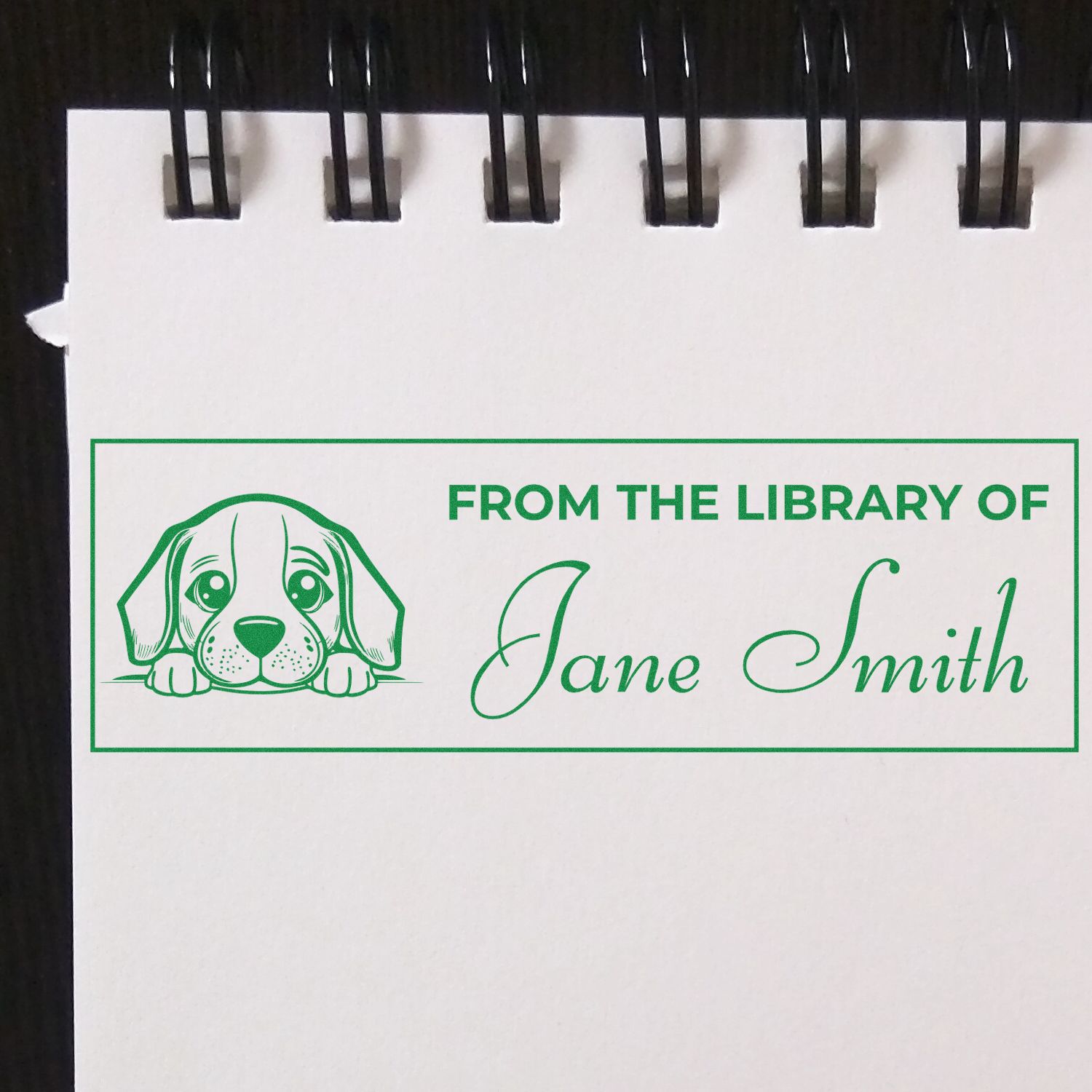 Personalized rubber stamp bookplate with dog illustration and From the Library of Jane Smith text for custom library books.