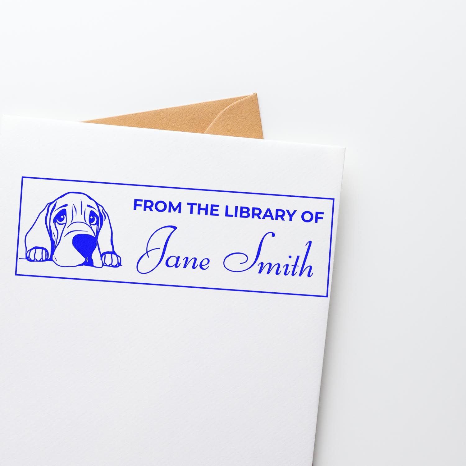 Custom book rubber stamp with dog illustration and personalized From the Library of Jane Smith design for library books.