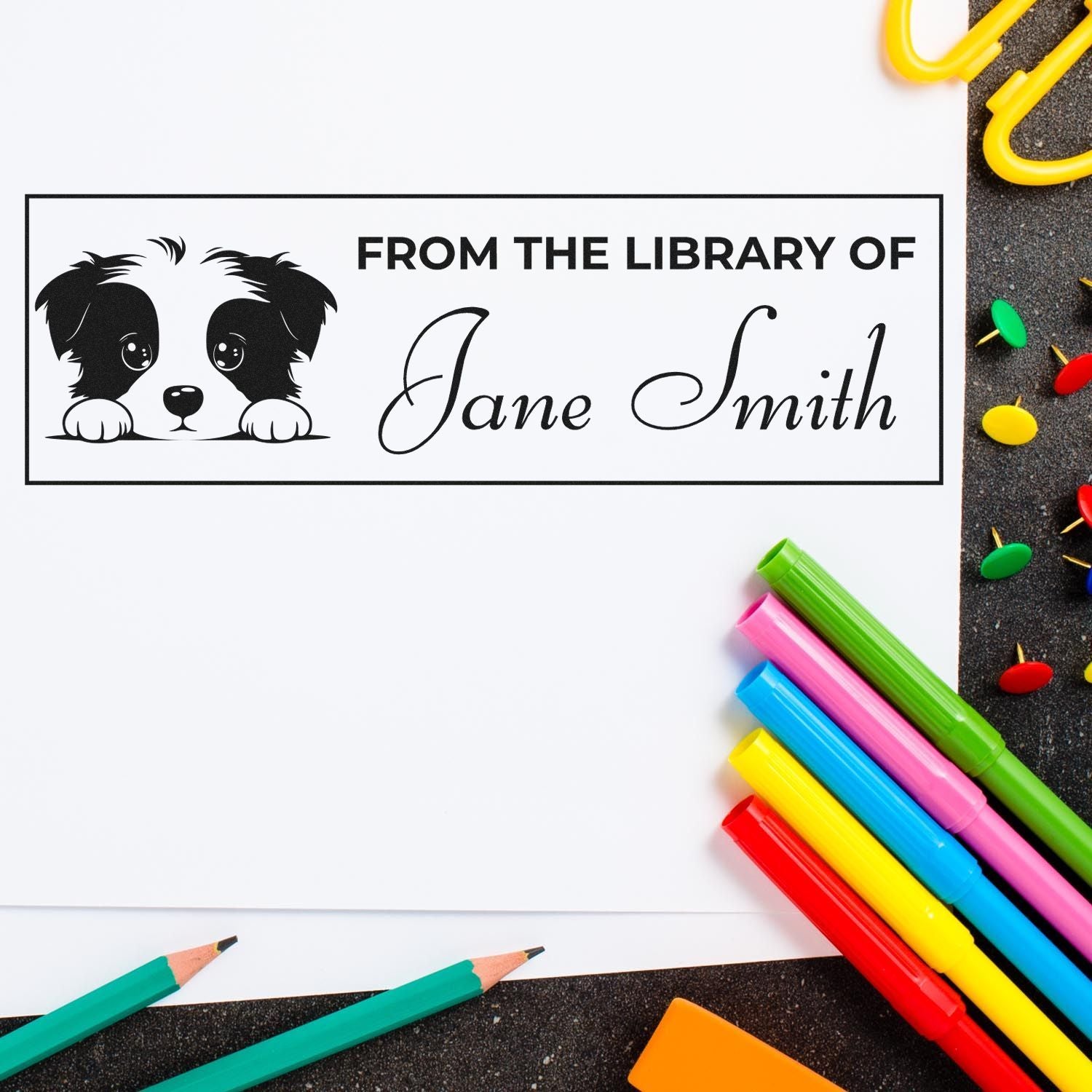 Personalized library book rubber stamp with dog illustration and From the Library of Jane Smith text for custom book ownership marking